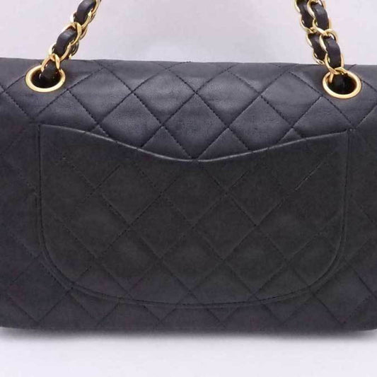 Luxury Chanel shoulder bag matelasse leather / metal black x gold ladies