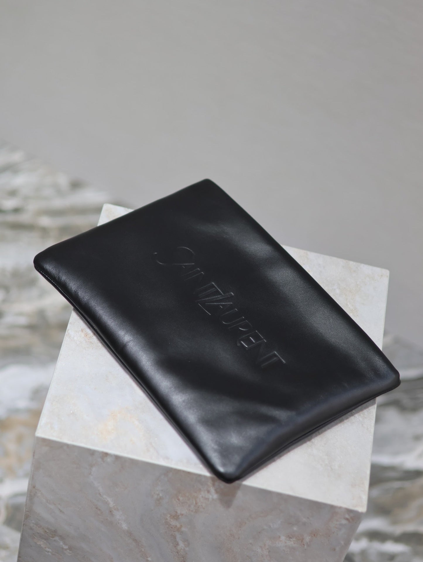 Luxury Saint Laurent POUCH 30 IN BLACK CALFSKIN WITH EMBOSSED LOGO