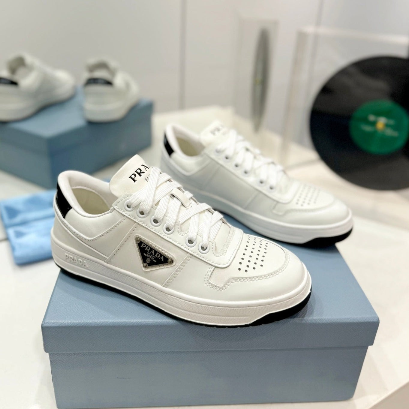 Luxury PradaDOWNTOWN PERFORATED SNEAKERS WHITE AND BLACK LOGO CALFSKIN