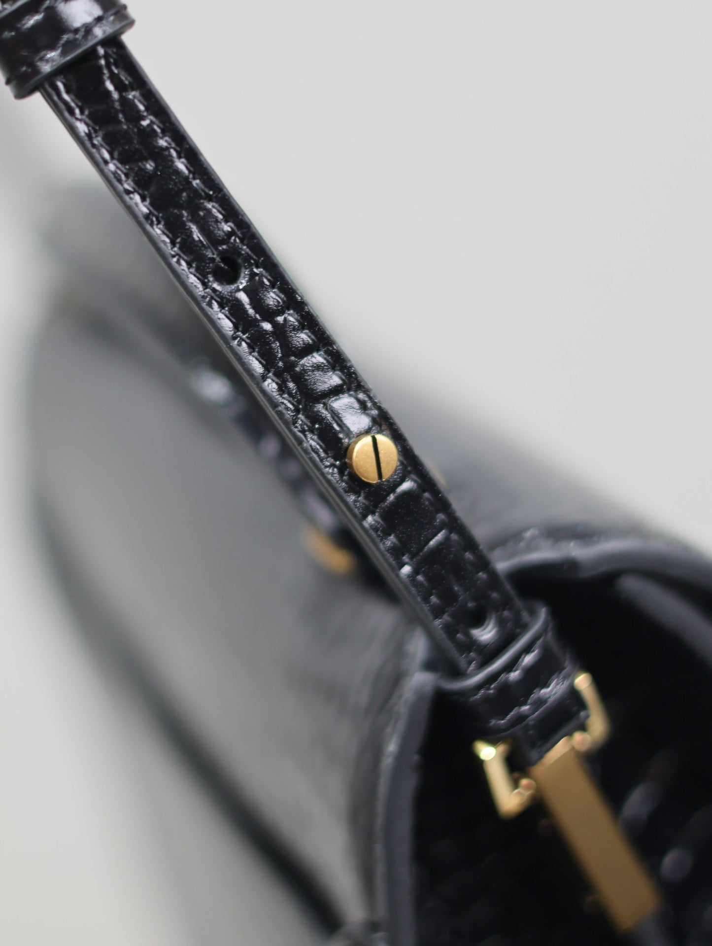 Luxury Saint Laurent CASSANDRA TOP HANDLE BAG 24 IN BLACK CROCODILE-EMBOSSED GLOSSY CALFSKIN