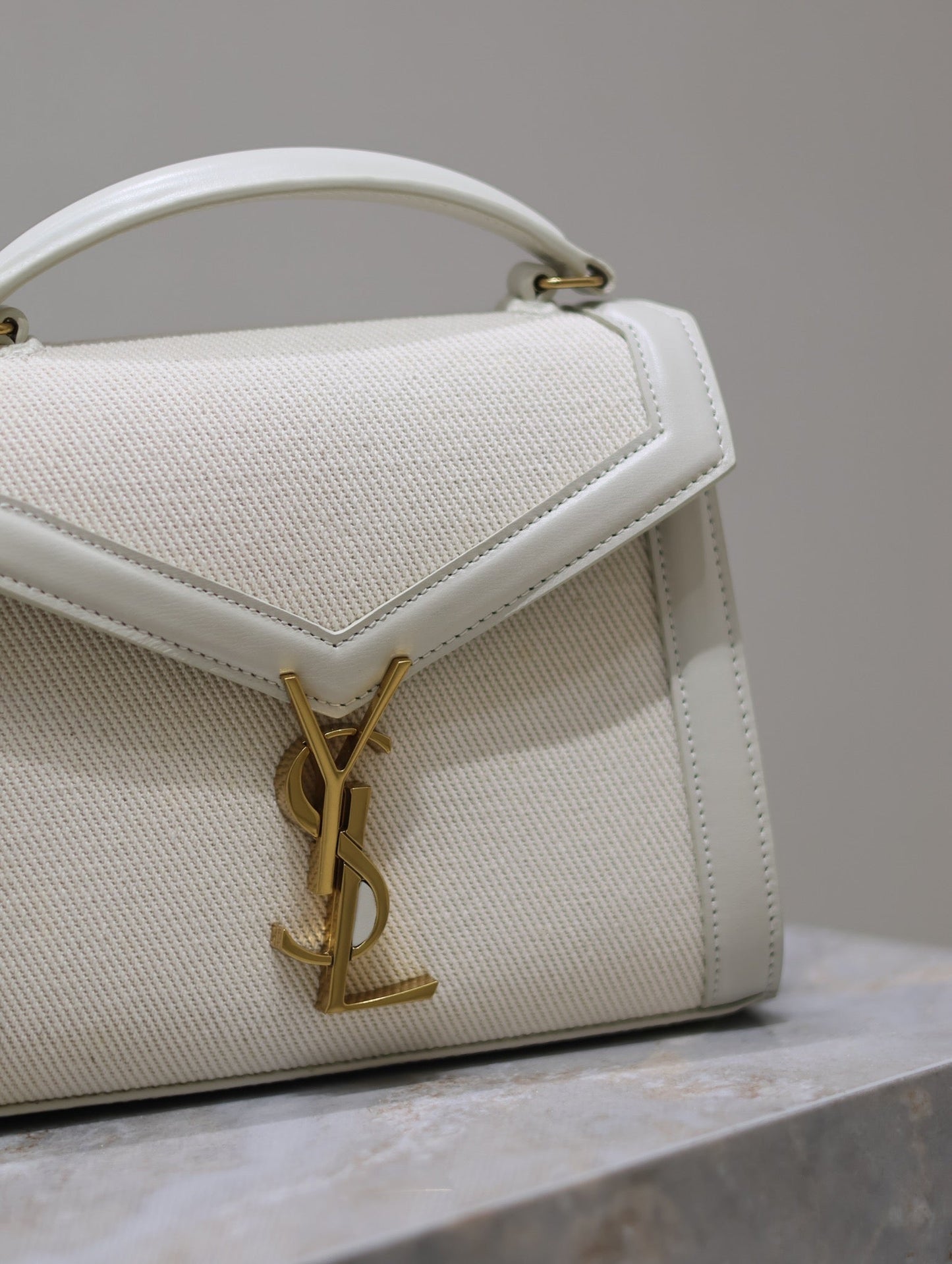Luxury Saint Laurent CASSANDRA MINI TOP HANDLE BAG 20 IN WHITE CANVAS AND LEATHER TRIM
