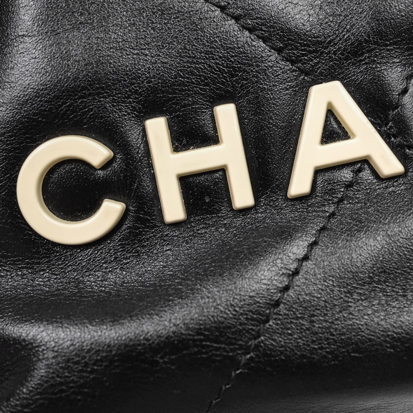Chanel 22 Mini Bag Black Crumpled Calfskin White Lacquered Metal Logo