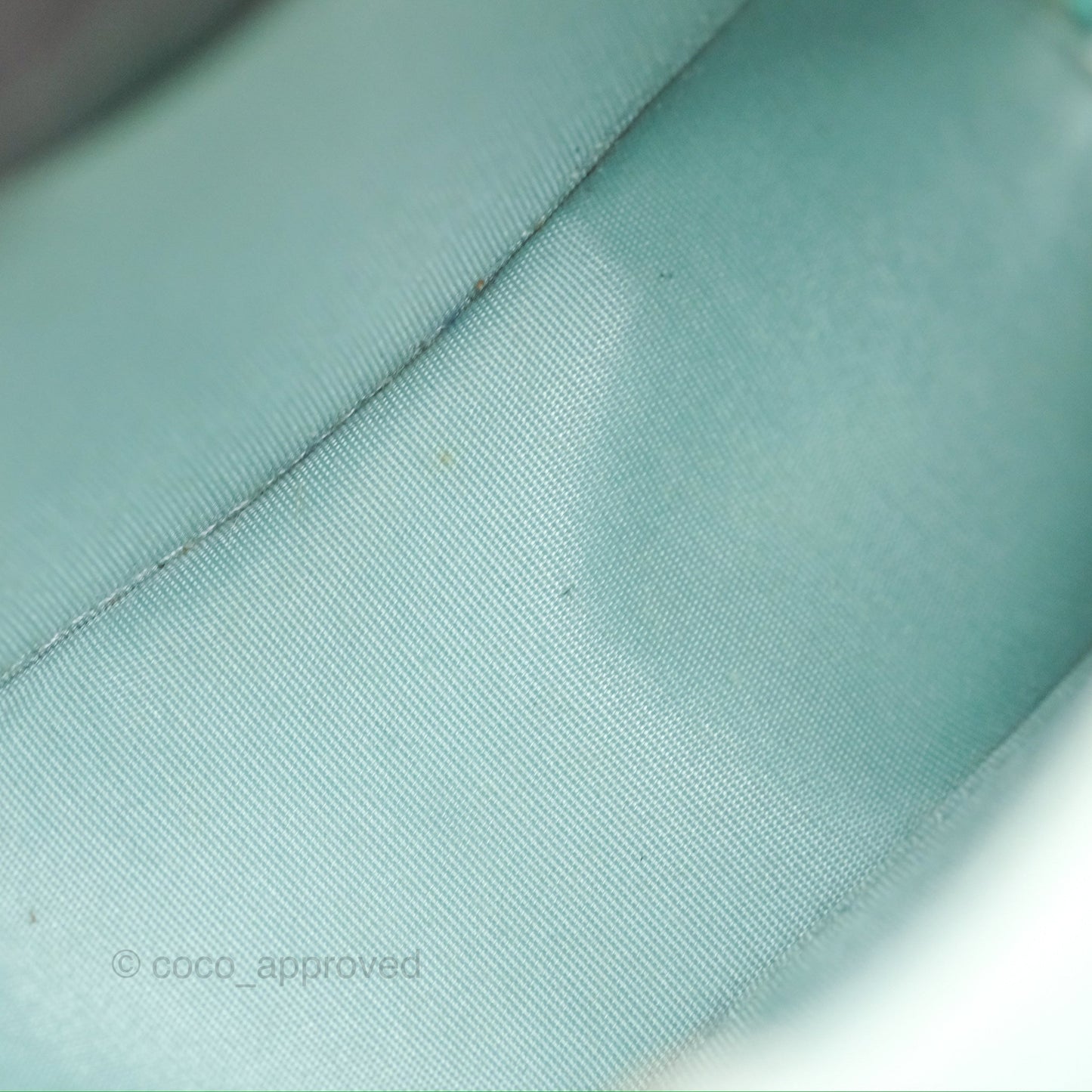 Chanel Camellia Embossed Round Clutch With Chain Light Tiffany Blue Caviar