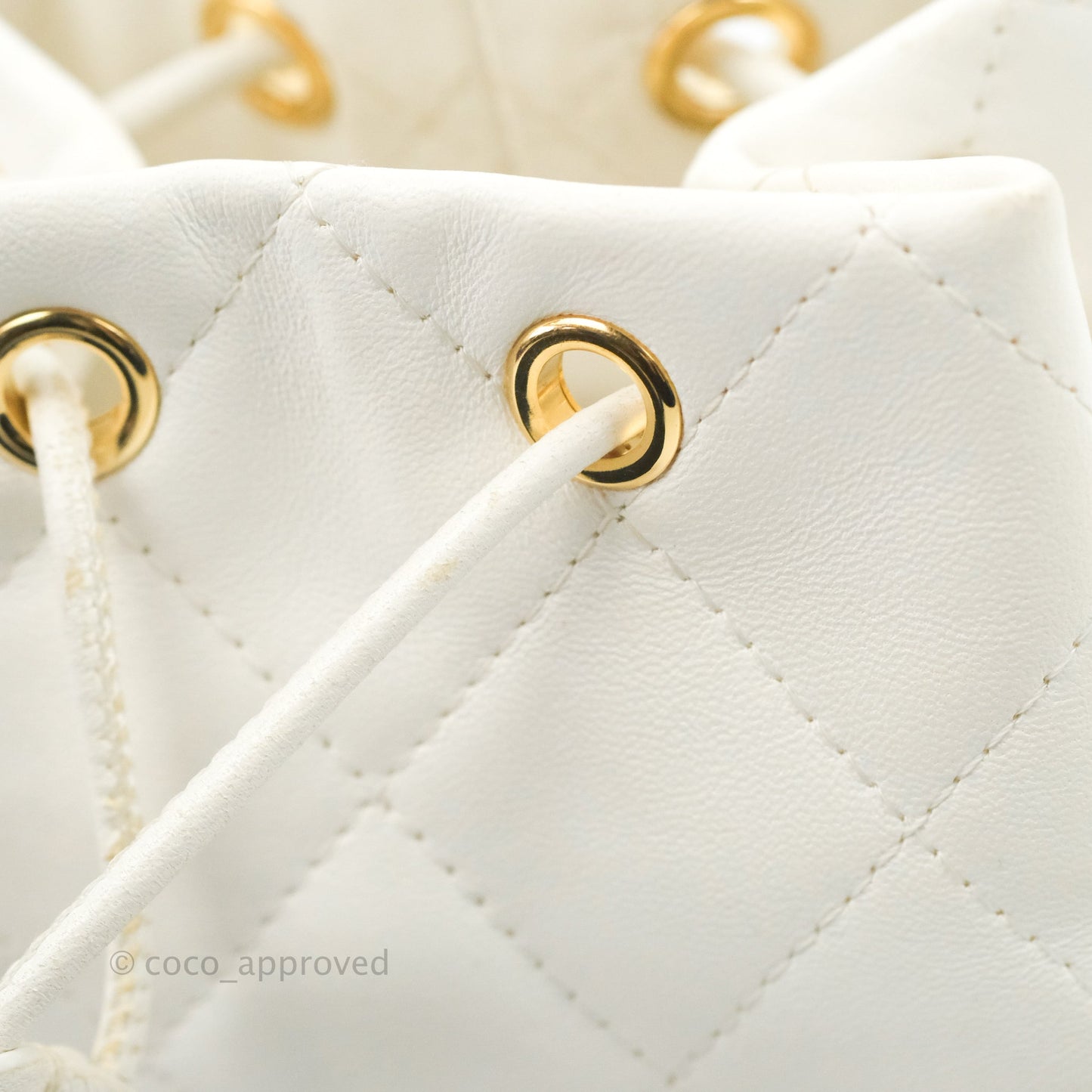 Chanel Quilted Small Drawstring Bucket Bag White Calfskin Gold Hardware