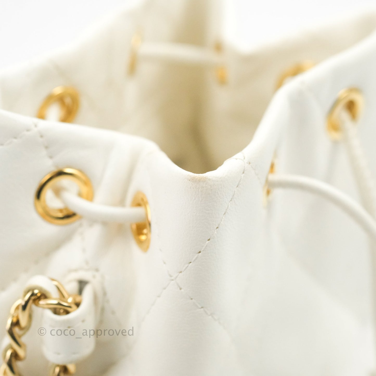 Chanel Quilted Small Drawstring Bucket Bag White Calfskin Gold Hardware