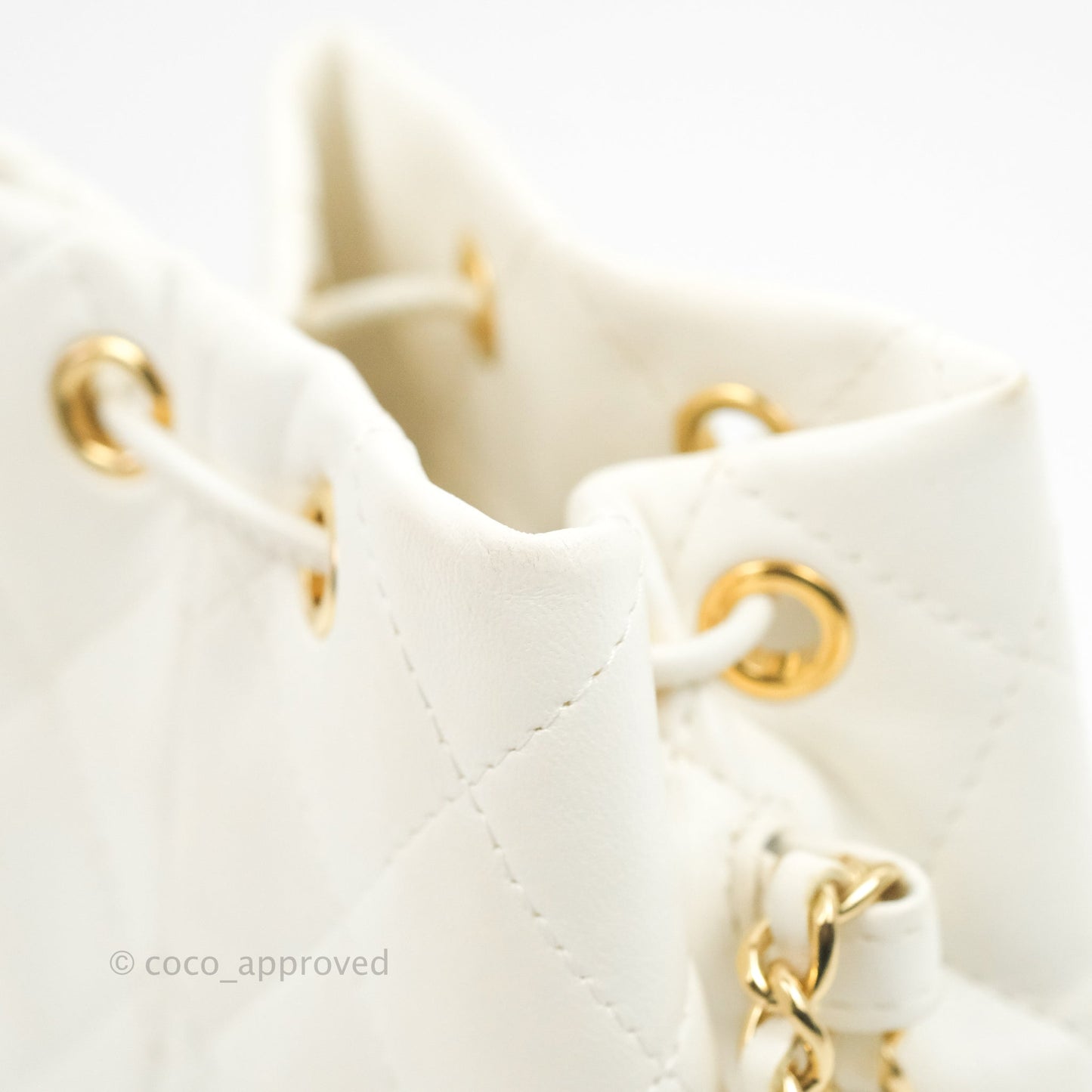 Chanel Quilted Small Drawstring Bucket Bag White Calfskin Gold Hardware