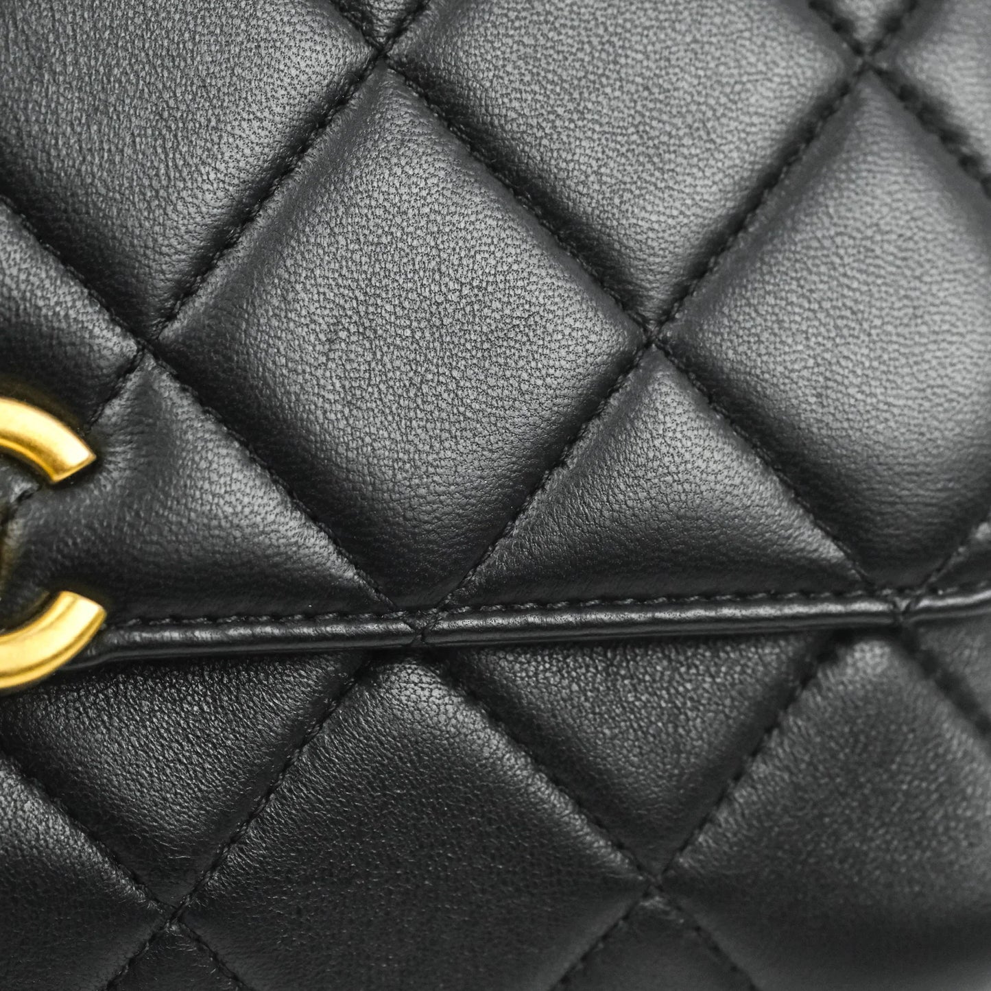 Chanel Quilted Small Flap Bag with CC Crystal Logo Handle Black Lambskin Aged Gold Hardware