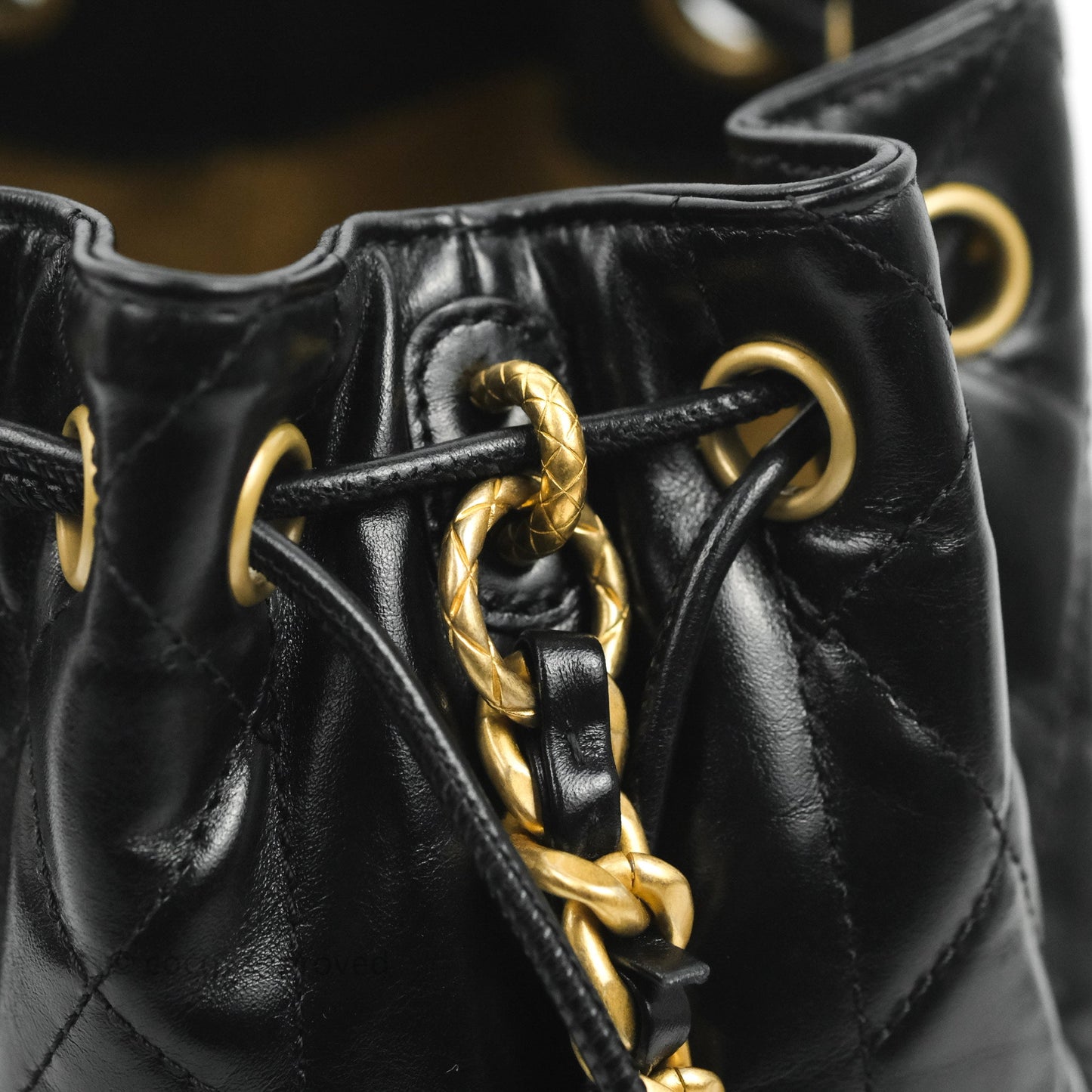 Chanel Quilted Drawstring Bucket Bag Black Calfskin Aged Gold Hardware