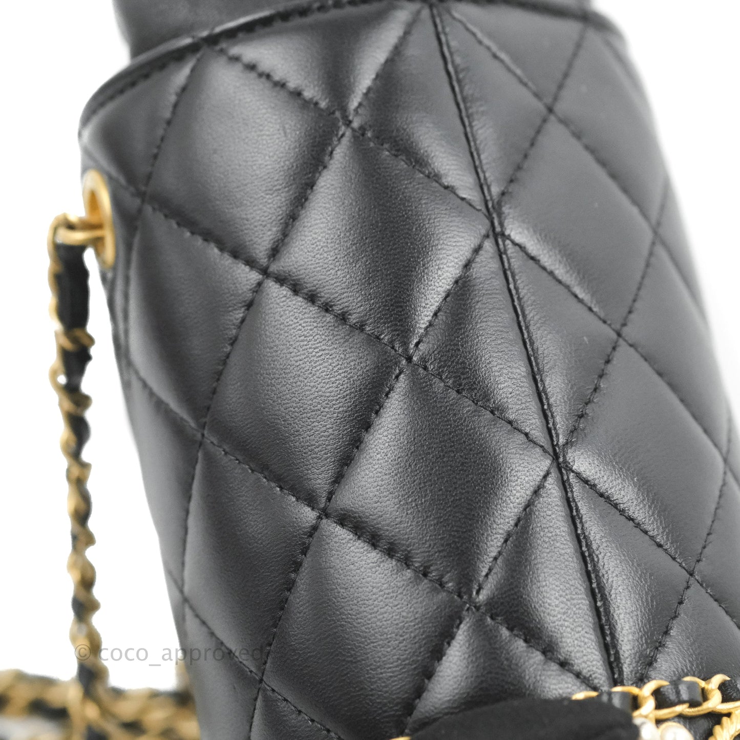 Chanel Quilted Drawstring Pearl Flower Bucket Bag Black Lambskin Aged Gold Hardware