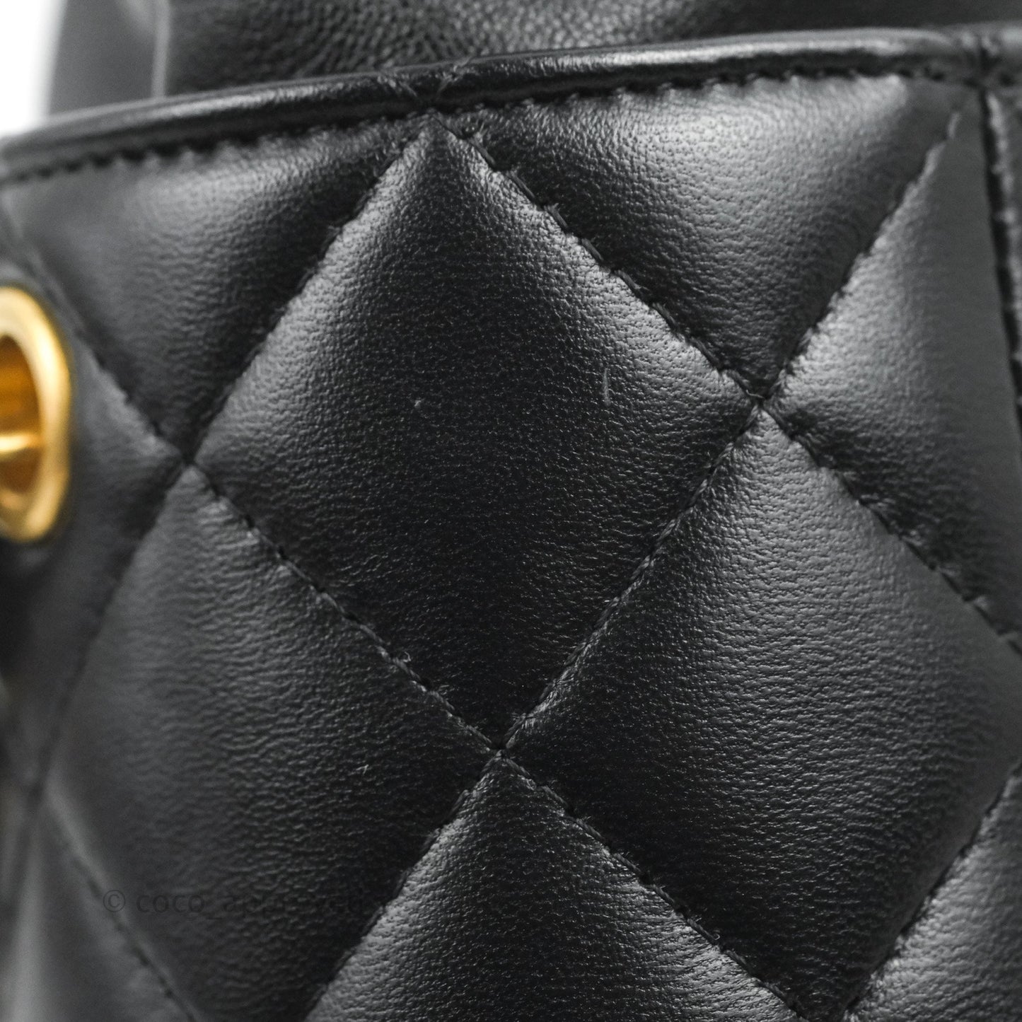 Chanel Quilted Drawstring Pearl Flower Bucket Bag Black Lambskin Aged Gold Hardware