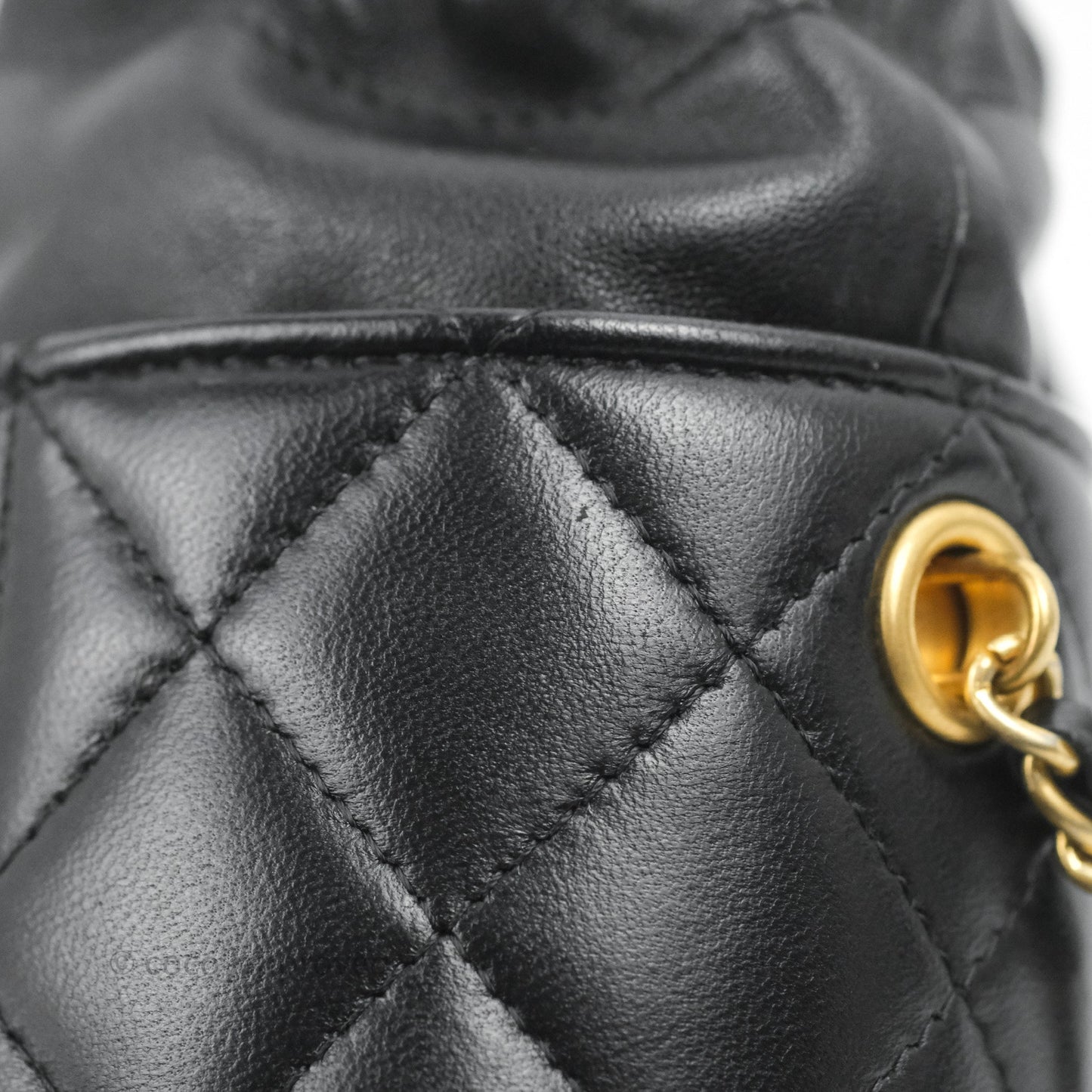 Chanel Quilted Drawstring Pearl Flower Bucket Bag Black Lambskin Aged Gold Hardware