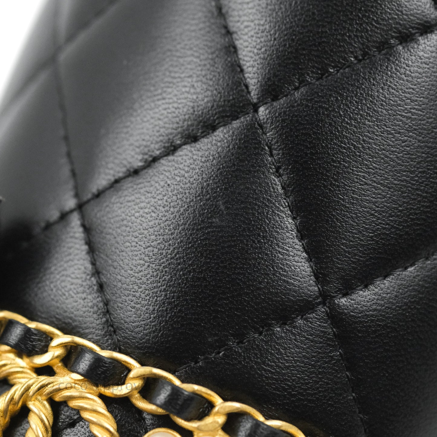 Chanel Quilted Drawstring Pearl Flower Bucket Bag Black Lambskin Aged Gold Hardware