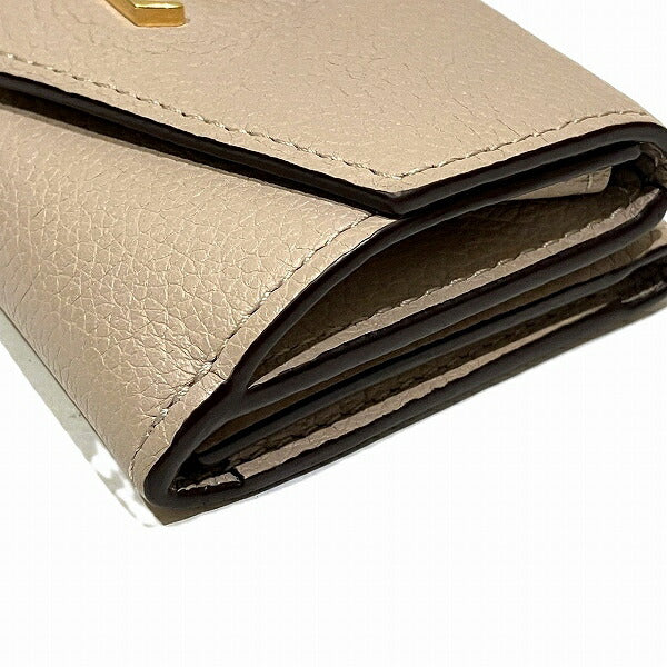 Louis Vuitton Leather Portefeuille Lock Mini Wallet