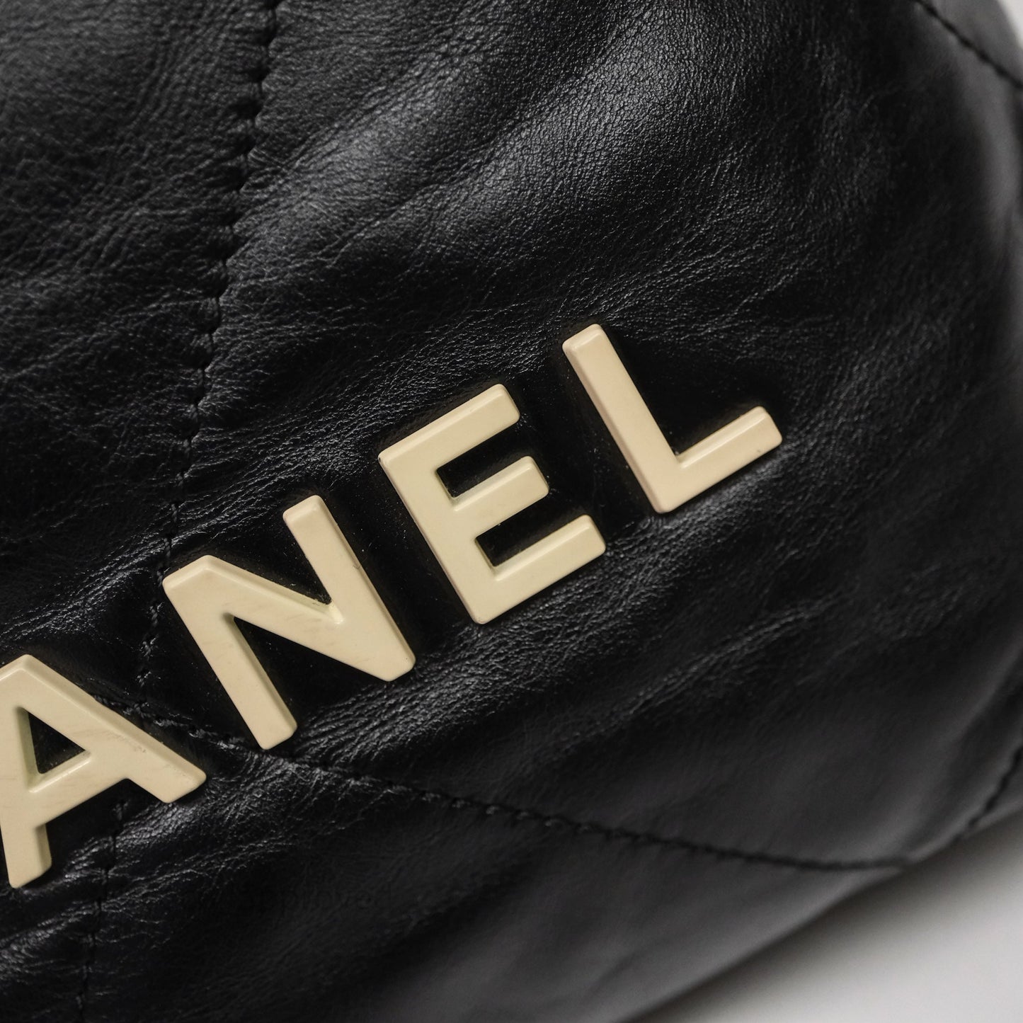 Chanel 22 Mini Bag Black Crumpled Calfskin White Lacquered Metal Logo