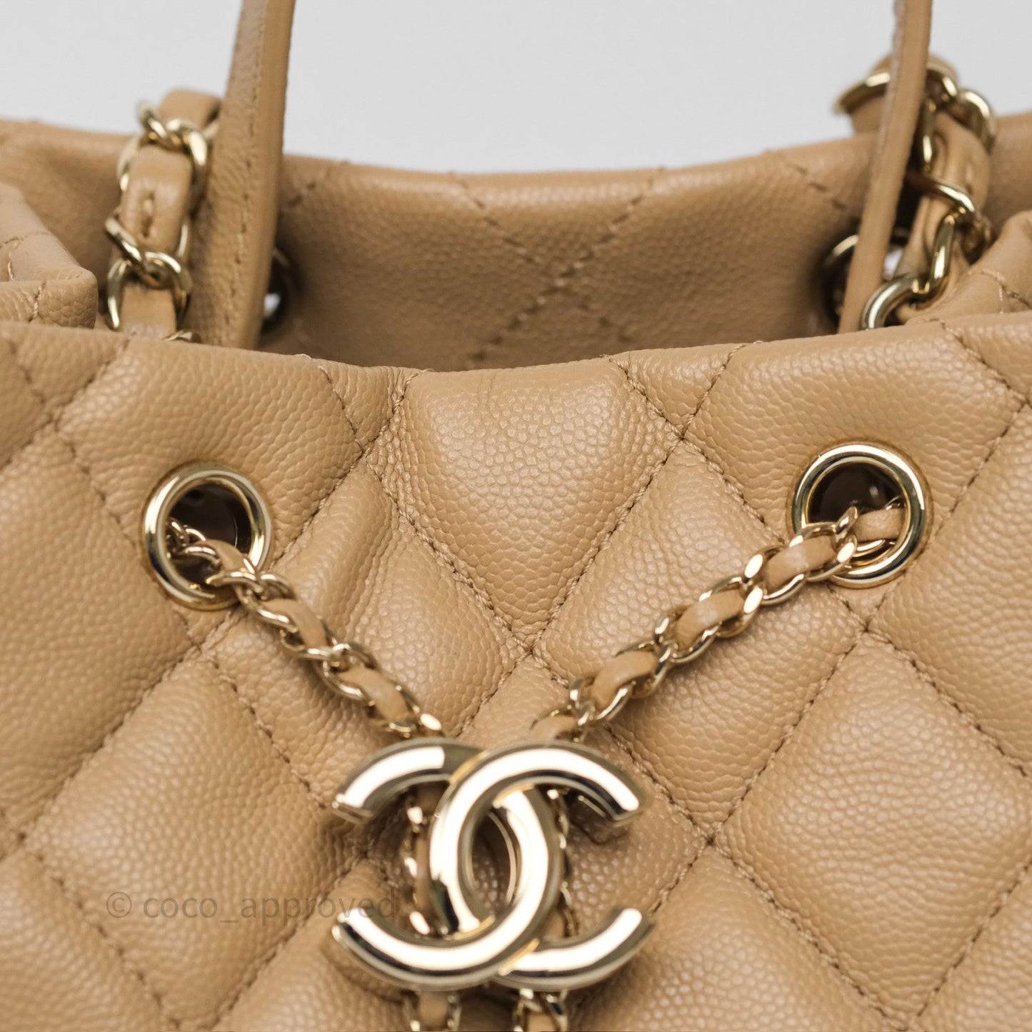 Chanel Rolled Up Bucket Drawstring Bag Beige Caviar Gold Hardware