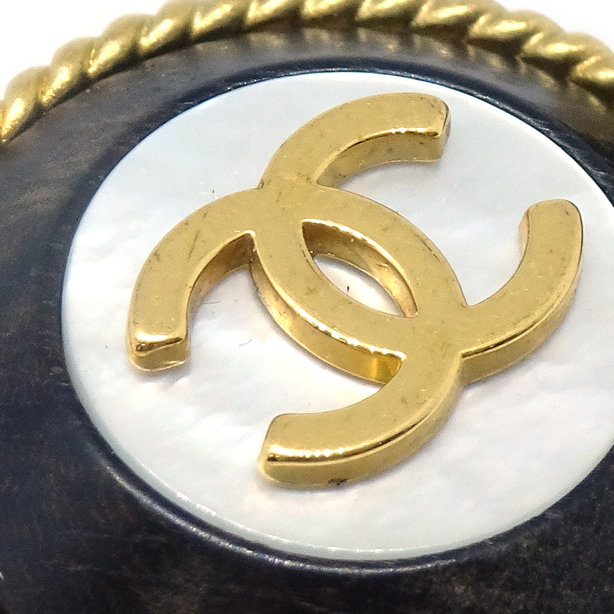 Luxury Chanel 1994 Mother of Pearl 'CC' Rope Edge Button Earrings