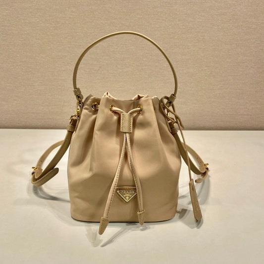 Luxury PradaBUCKET BAG 19 IN BEIGE RE-NYLON AND SAFFIANO LEATHER HANDLE