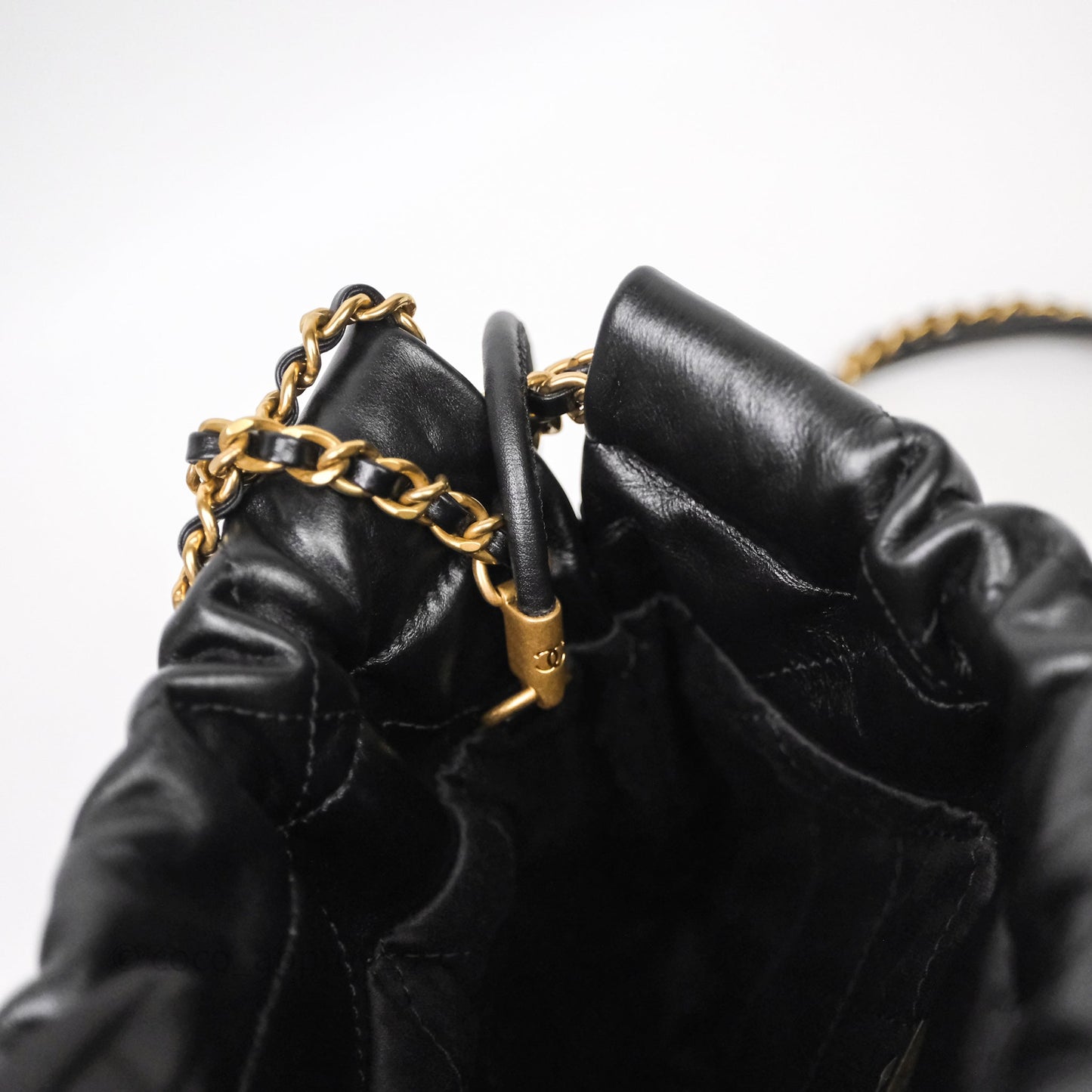 Chanel 22 Mini Bag Black Crumpled Calfskin White Lacquered Metal Logo