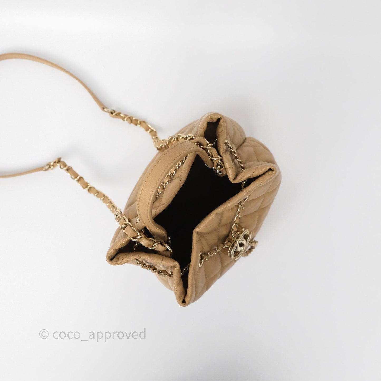 Chanel Rolled Up Bucket Drawstring Bag Beige Caviar Gold Hardware