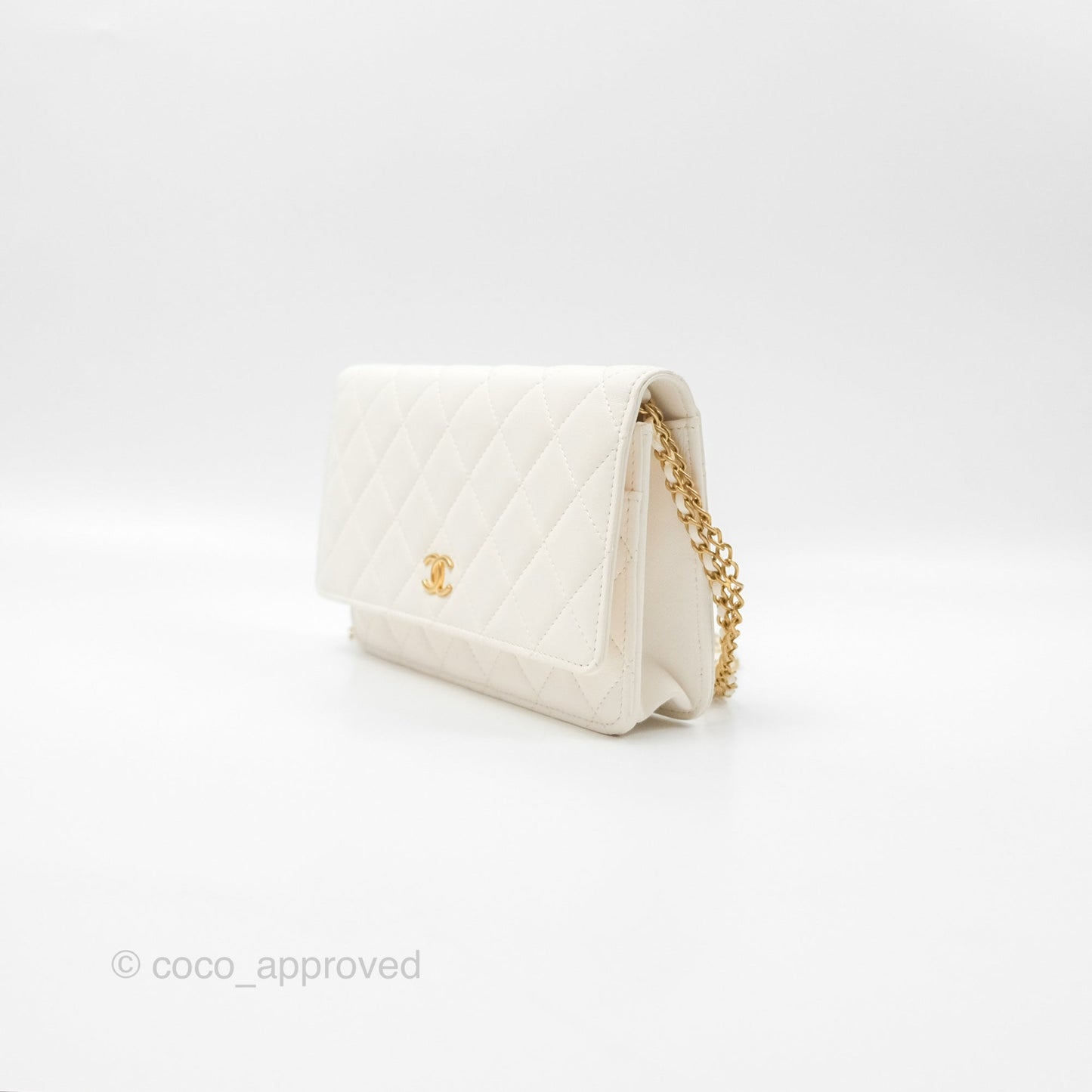 Chanel Quilted WOC White Lambskin Gold Hardware With Charms