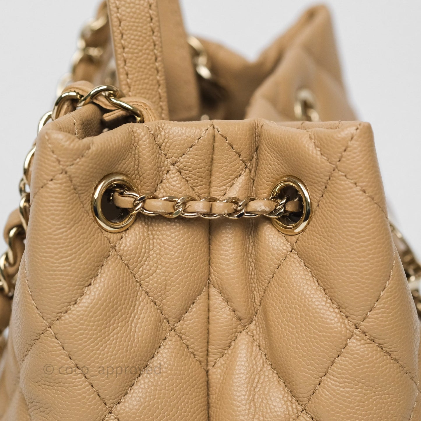 Chanel Rolled Up Bucket Drawstring Bag Beige Caviar Gold Hardware