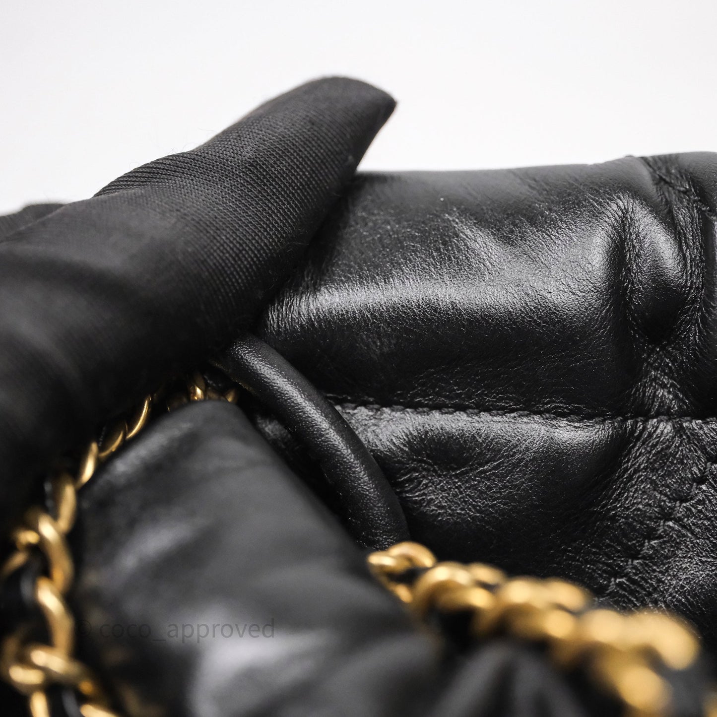 Chanel 22 Mini Bag Black Crumpled Calfskin White Lacquered Metal Logo