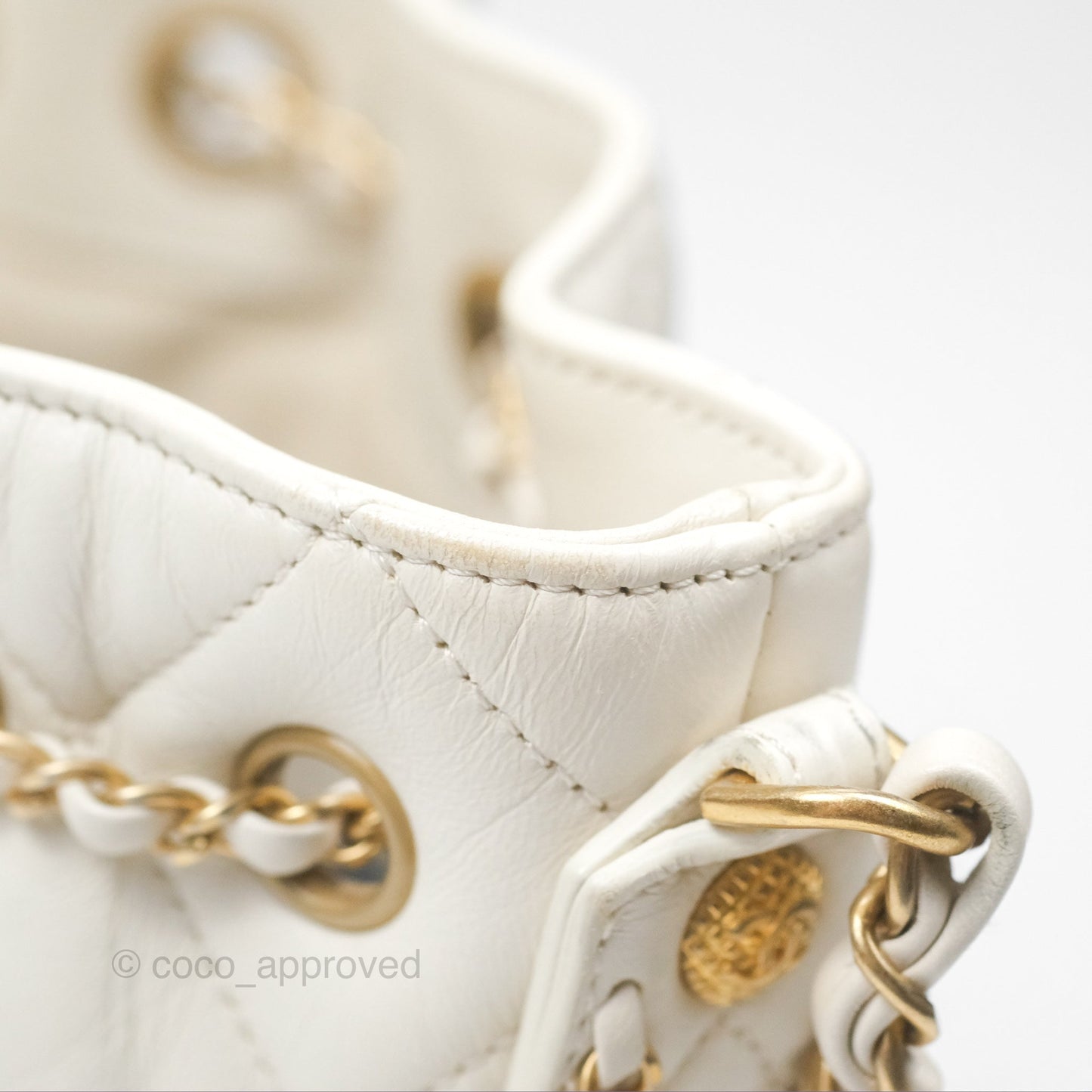 Chanel Quilted Drawstring Bucket Bag Ivory Lambskin Aged Gold Hardware