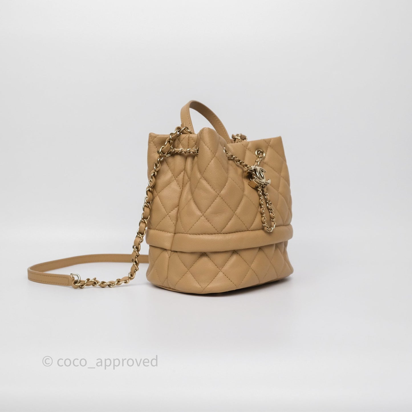 Chanel Rolled Up Bucket Drawstring Bag Beige Caviar Gold Hardware