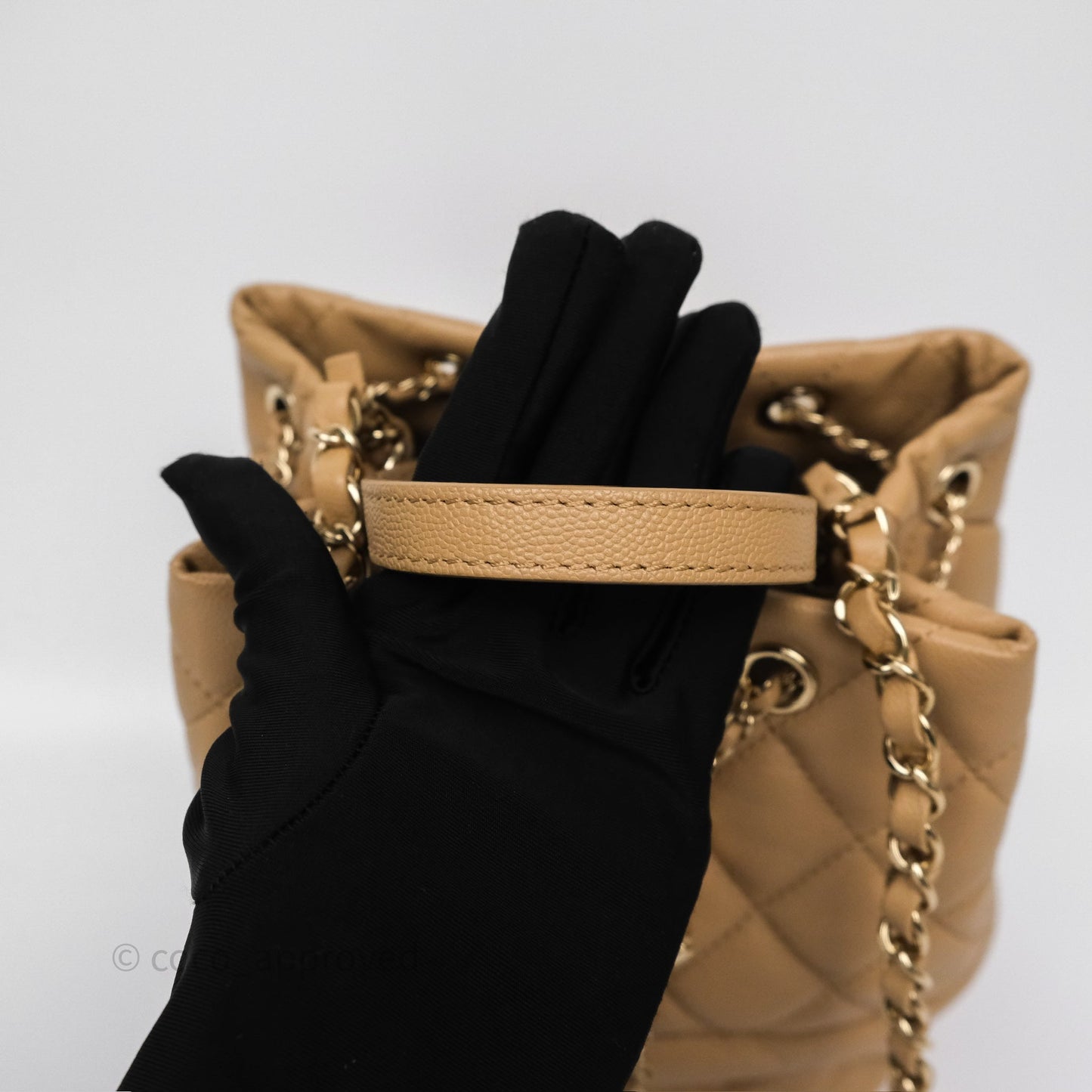 Chanel Rolled Up Bucket Drawstring Bag Beige Caviar Gold Hardware