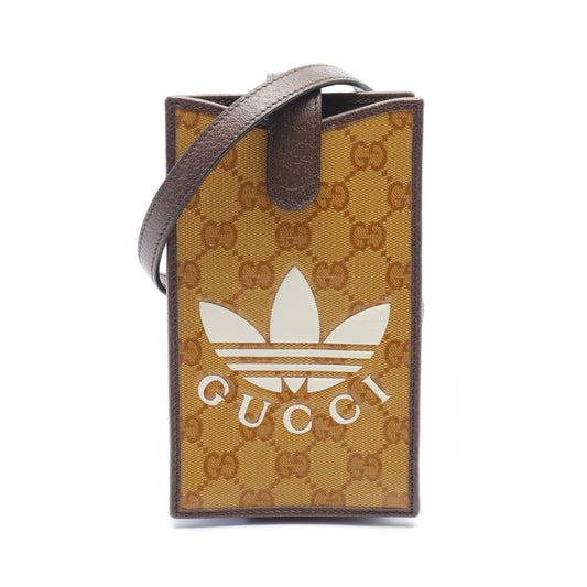 Luxury Gucci Trending 2025 Luxury Gucci Trending 2025 * adidas GG Crystal Smartphone case Shoulder bag Coated canvas Leather Yellow brown Dark brown