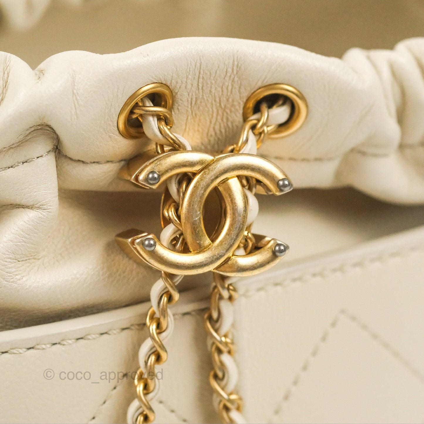 Chanel Quilted Drawstring Bucket Bag Ivory Lambskin Aged Gold Hardware 19C