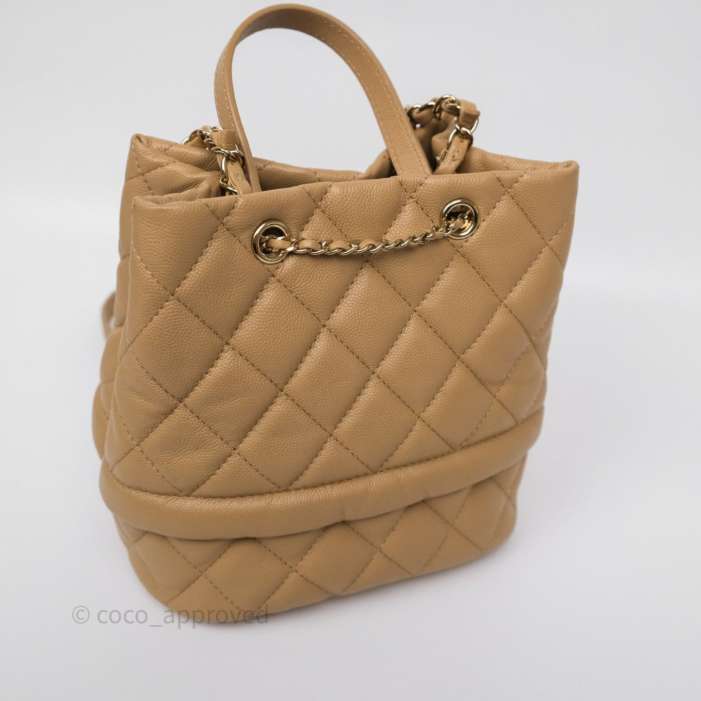Chanel Rolled Up Bucket Drawstring Bag Beige Caviar Gold Hardware