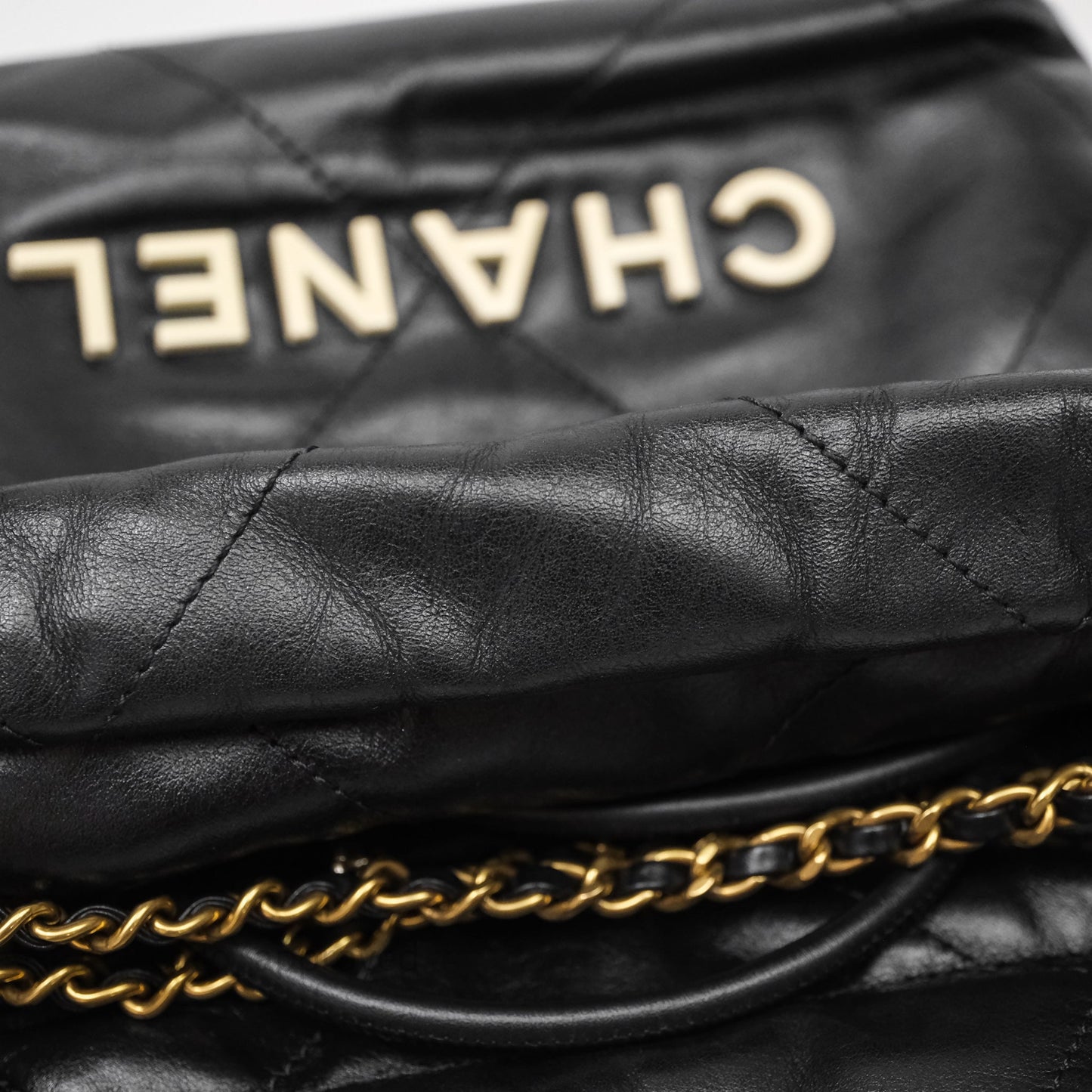 Chanel 22 Mini Bag Black Crumpled Calfskin White Lacquered Metal Logo