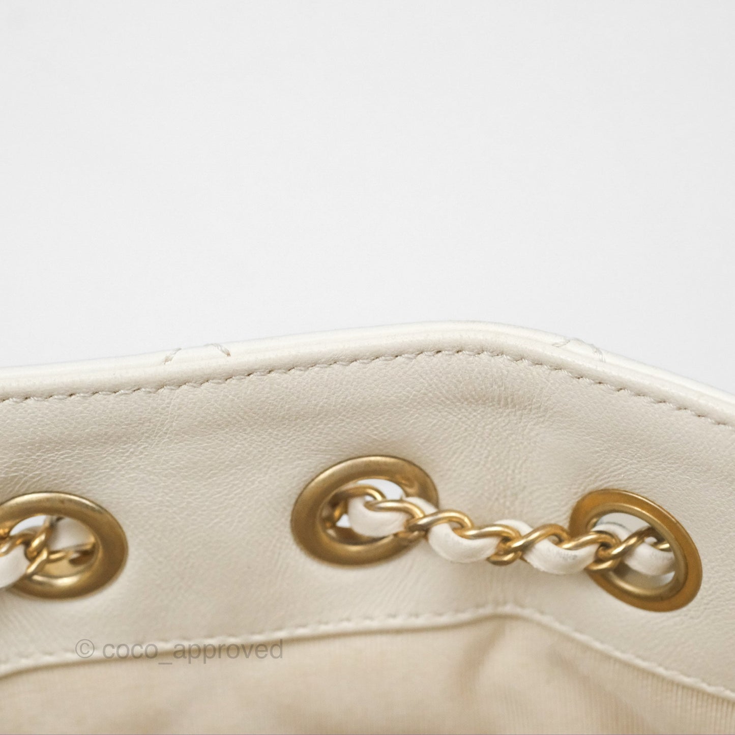 Chanel Quilted Drawstring Bucket Bag Ivory Lambskin Aged Gold Hardware