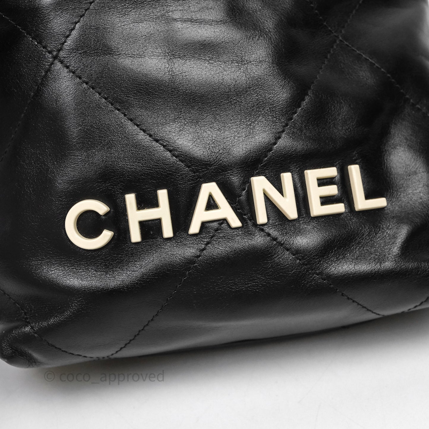 Chanel 22 Mini Bag Black Crumpled Calfskin White Lacquered Metal Logo