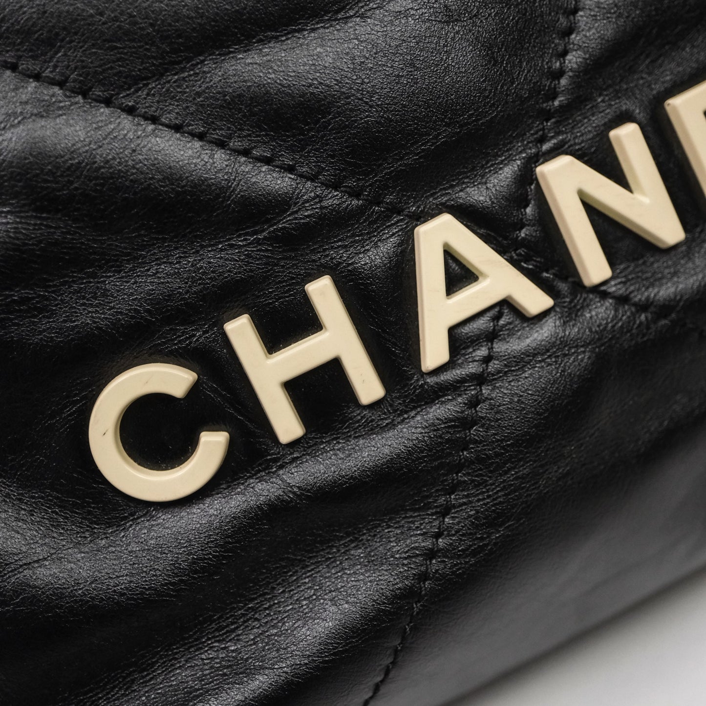 Chanel 22 Mini Bag Black Crumpled Calfskin White Lacquered Metal Logo