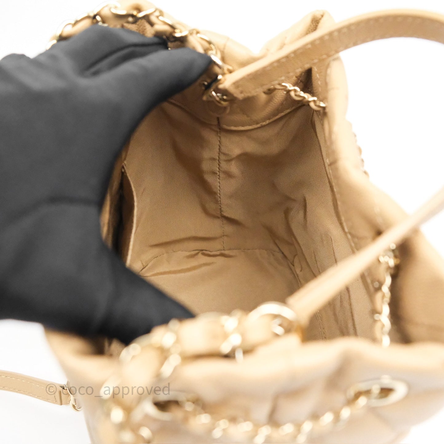 Chanel Rolled Up Bucket Drawstring Bag Beige Caviar Gold Hardware