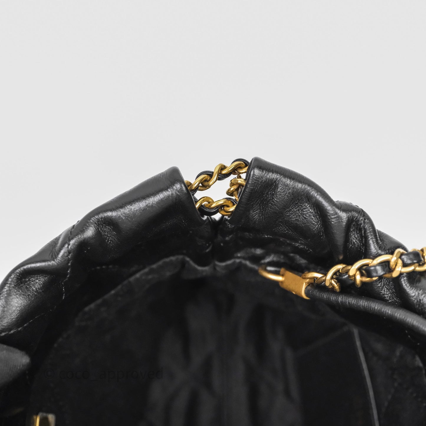 Chanel 22 Mini Bag Black Crumpled Calfskin White Lacquered Metal Logo