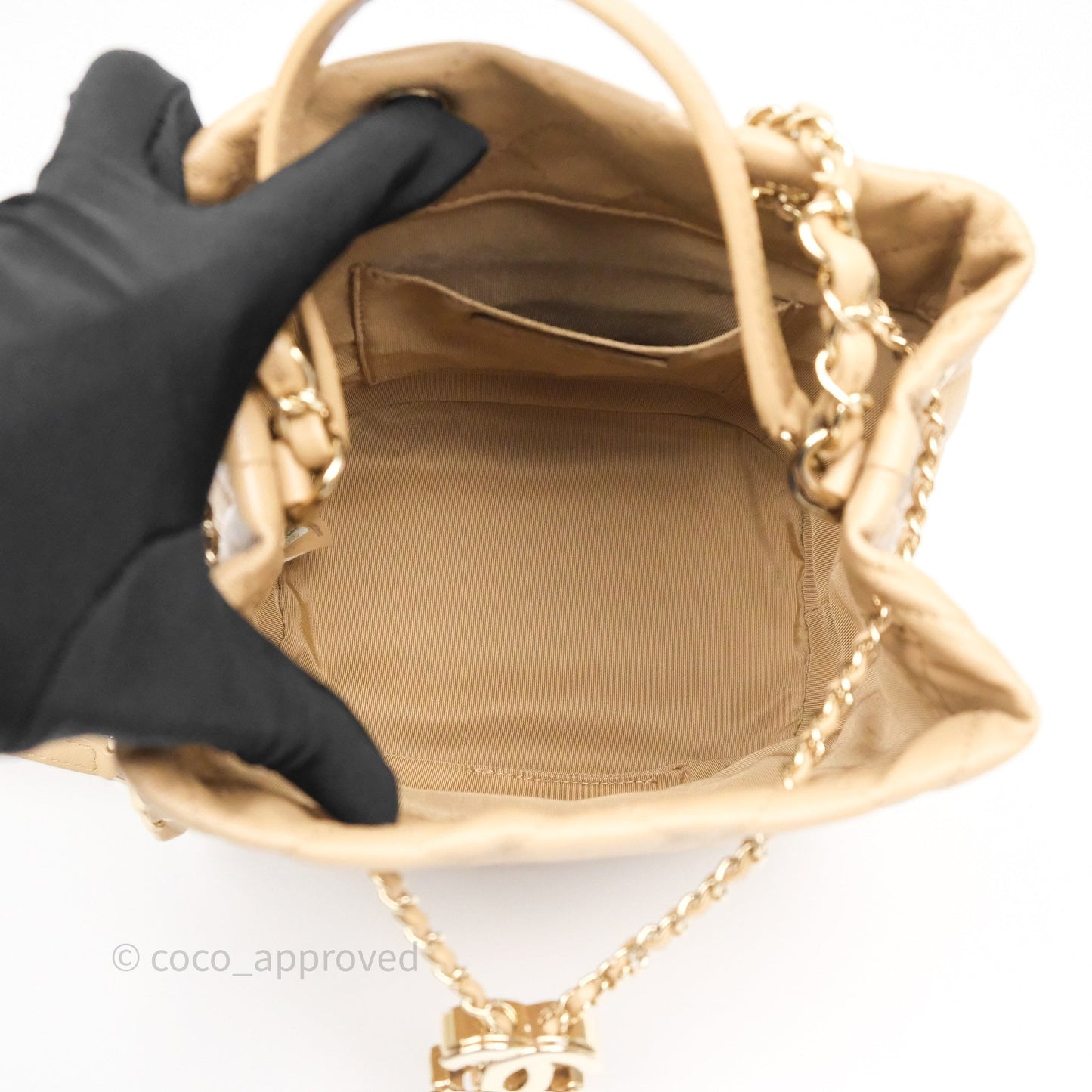 Chanel Rolled Up Bucket Drawstring Bag Beige Caviar Gold Hardware