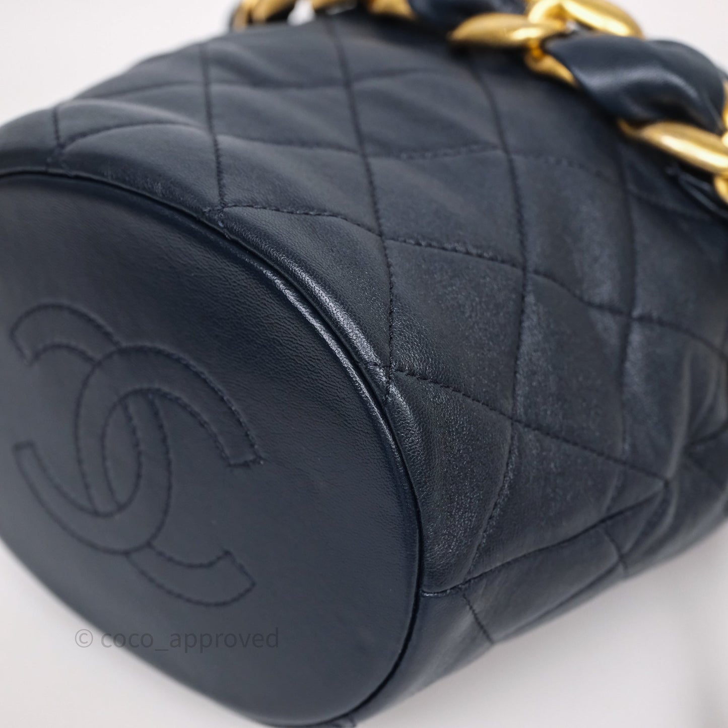 Chanel Small Entwined Chain Drawstring Bucket Bag Navy Lambskin Age Gold Hardware