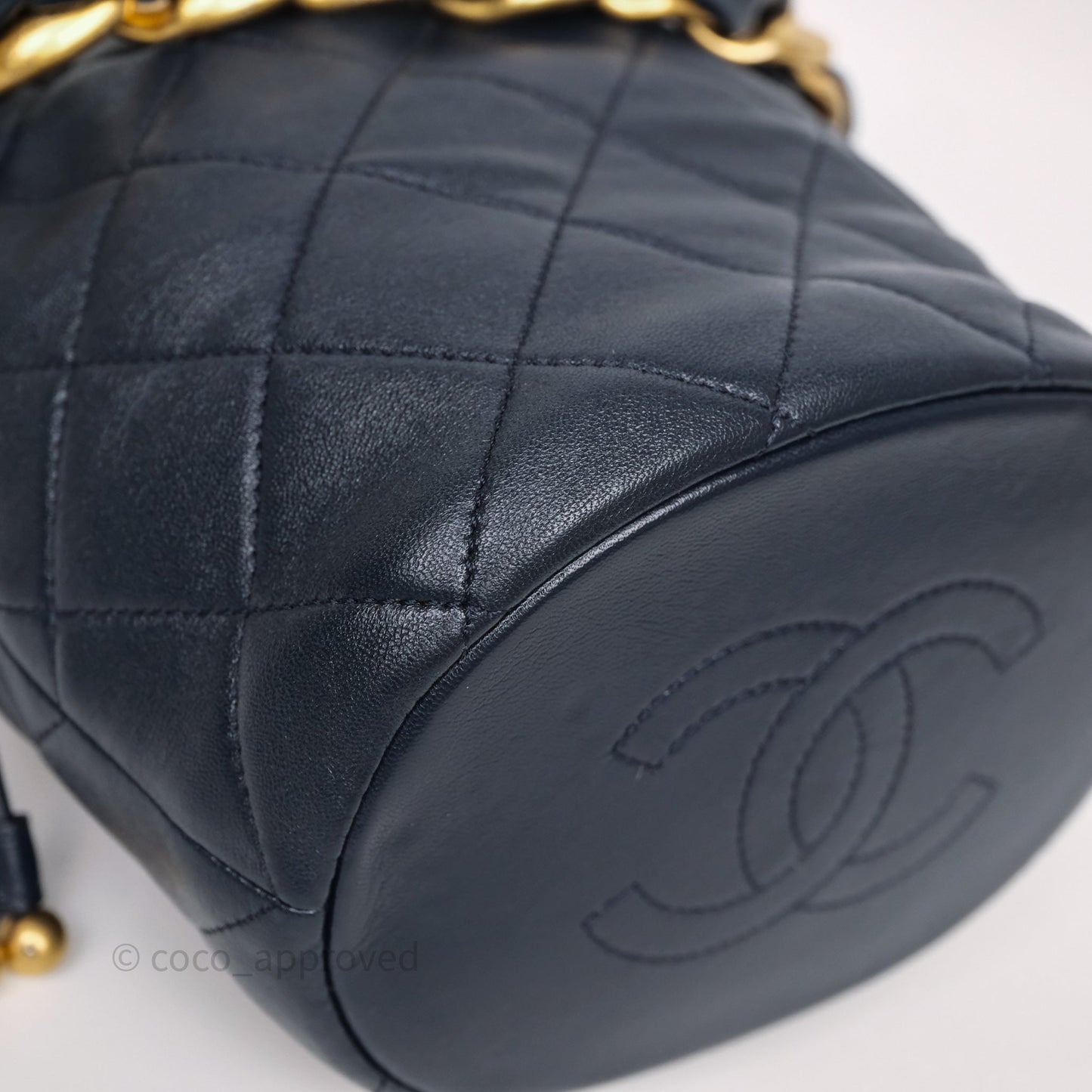 Chanel Small Entwined Chain Drawstring Bucket Bag Navy Lambskin Age Gold Hardware
