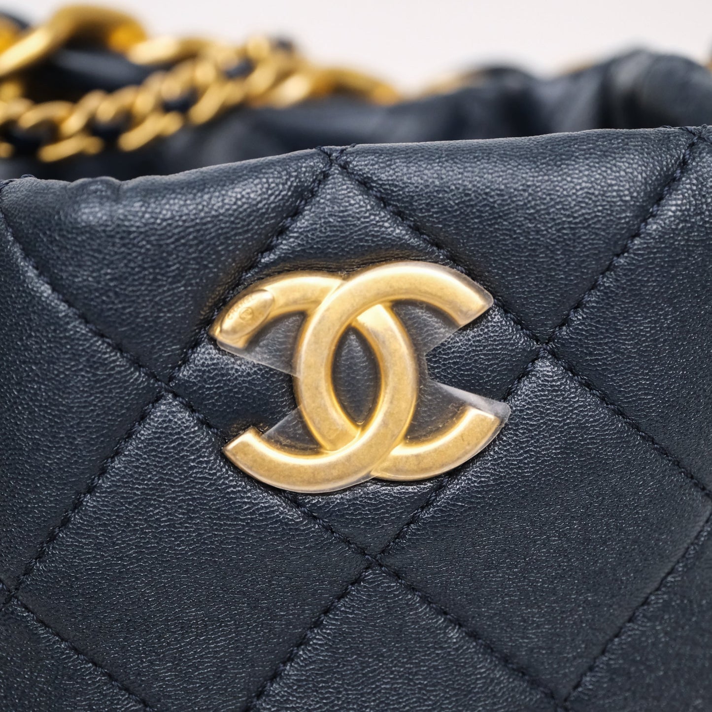 Chanel Small Entwined Chain Drawstring Bucket Bag Navy Lambskin Age Gold Hardware