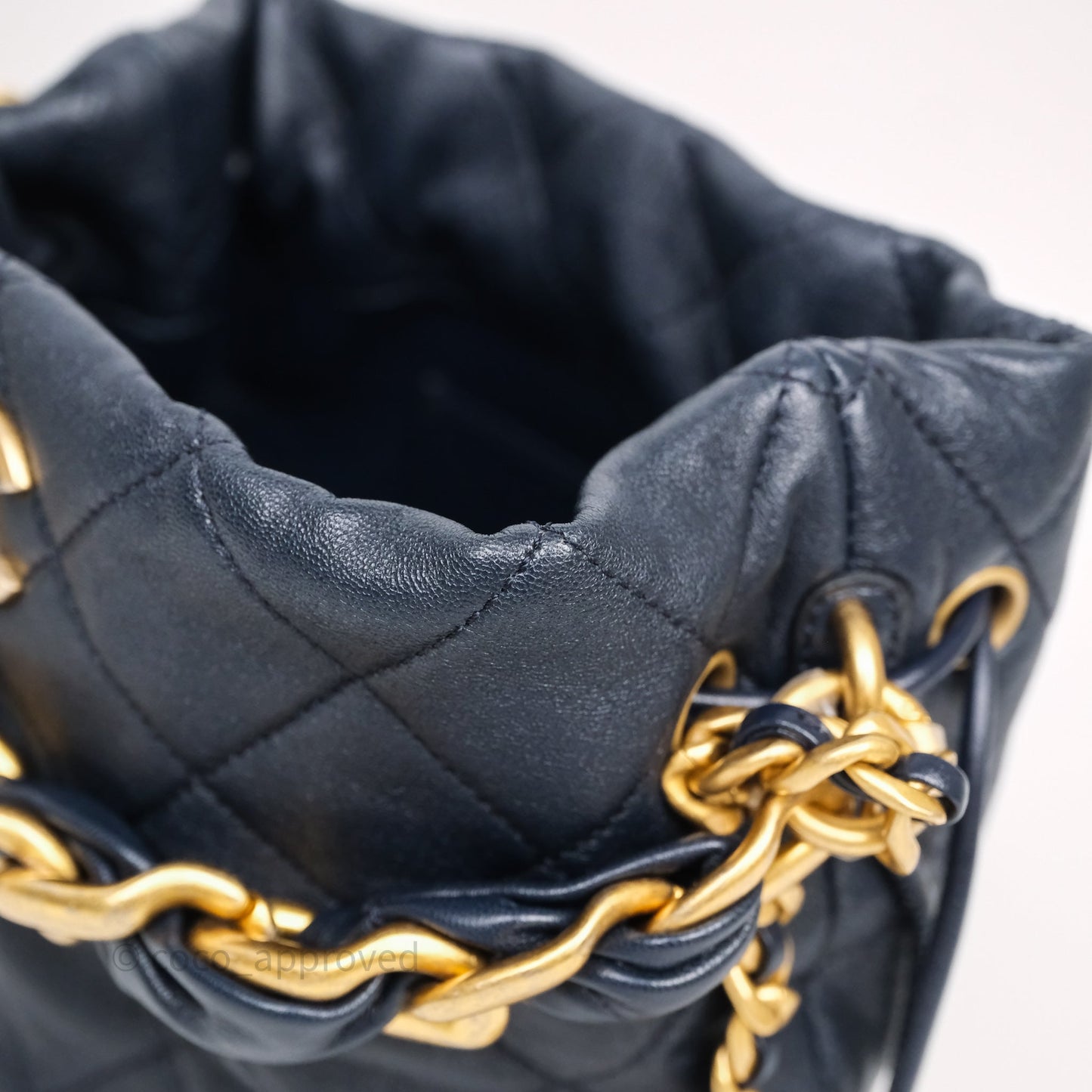 Chanel Small Entwined Chain Drawstring Bucket Bag Navy Lambskin Age Gold Hardware