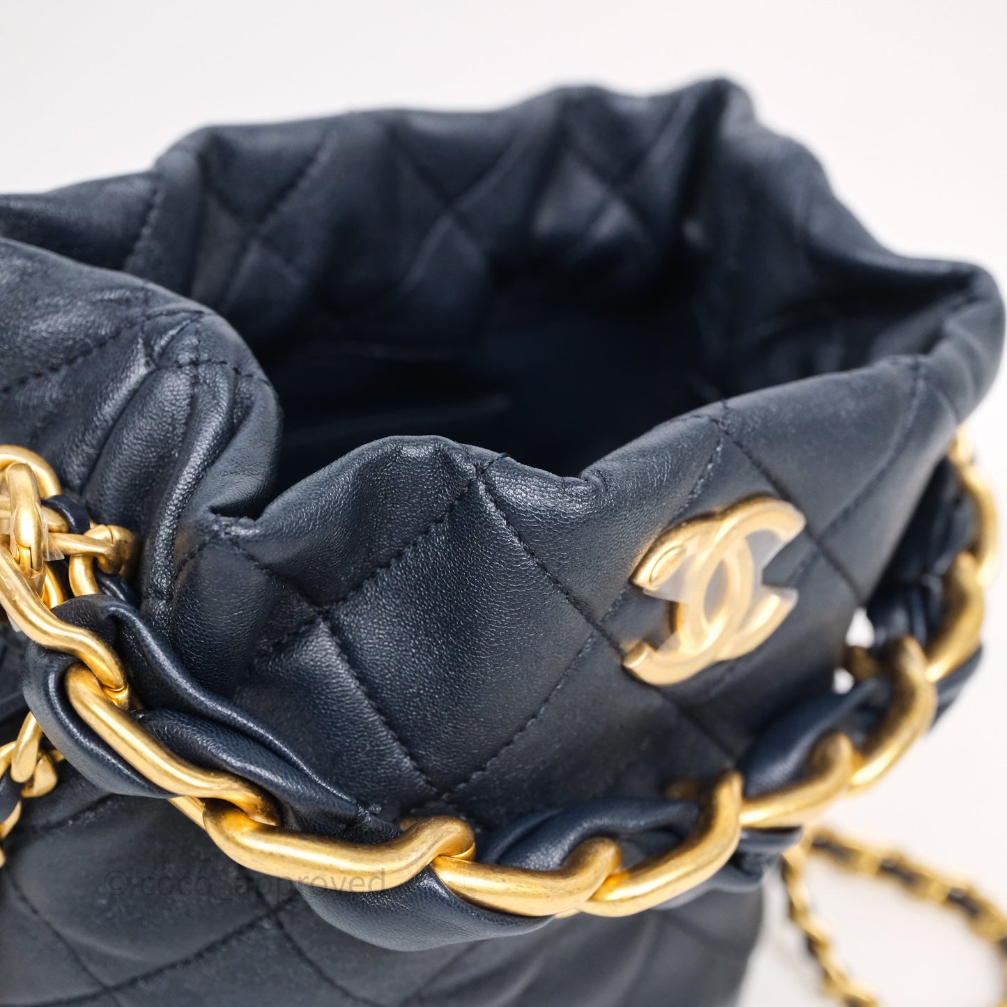 Chanel Small Entwined Chain Drawstring Bucket Bag Navy Lambskin Age Gold Hardware
