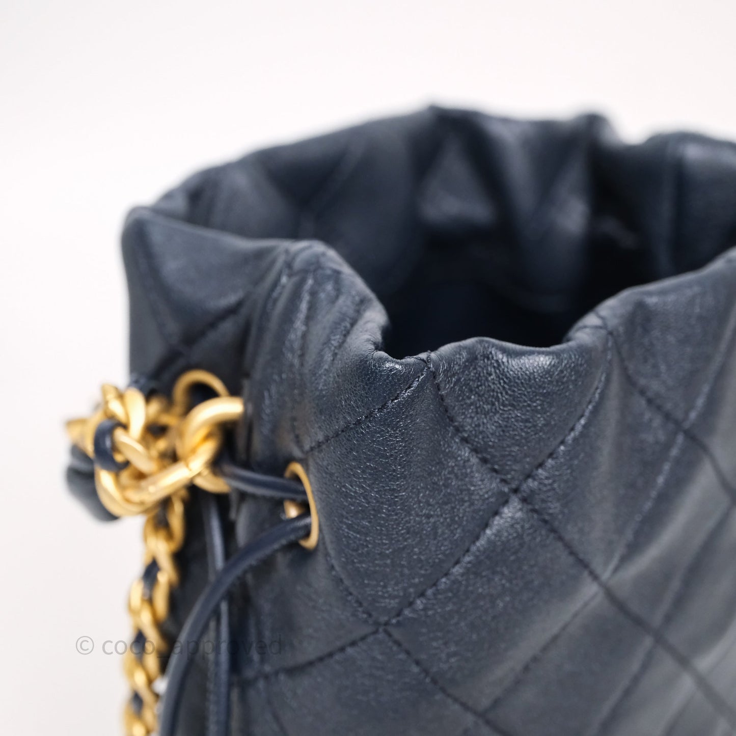 Chanel Small Entwined Chain Drawstring Bucket Bag Navy Lambskin Age Gold Hardware