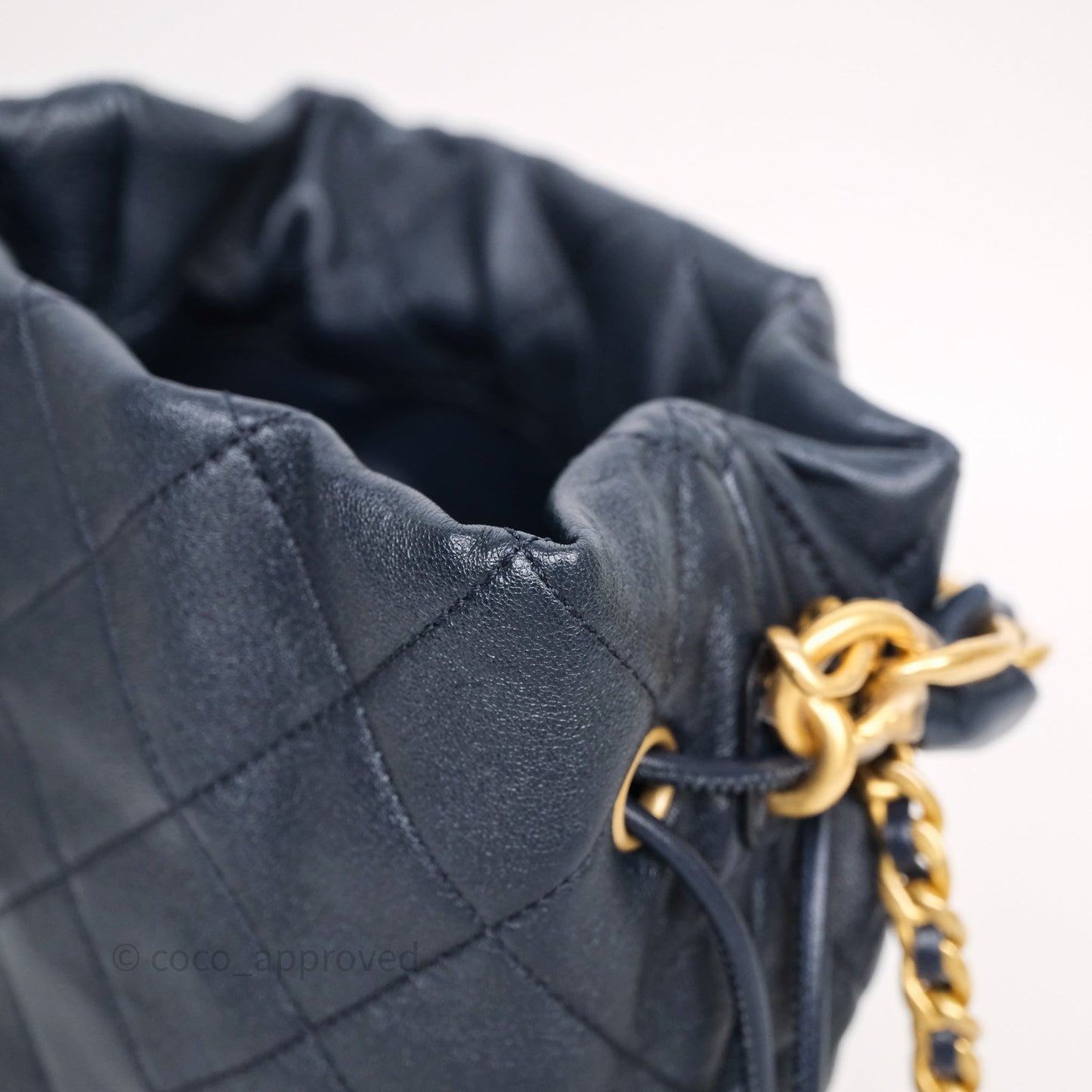 Chanel Small Entwined Chain Drawstring Bucket Bag Navy Lambskin Age Gold Hardware