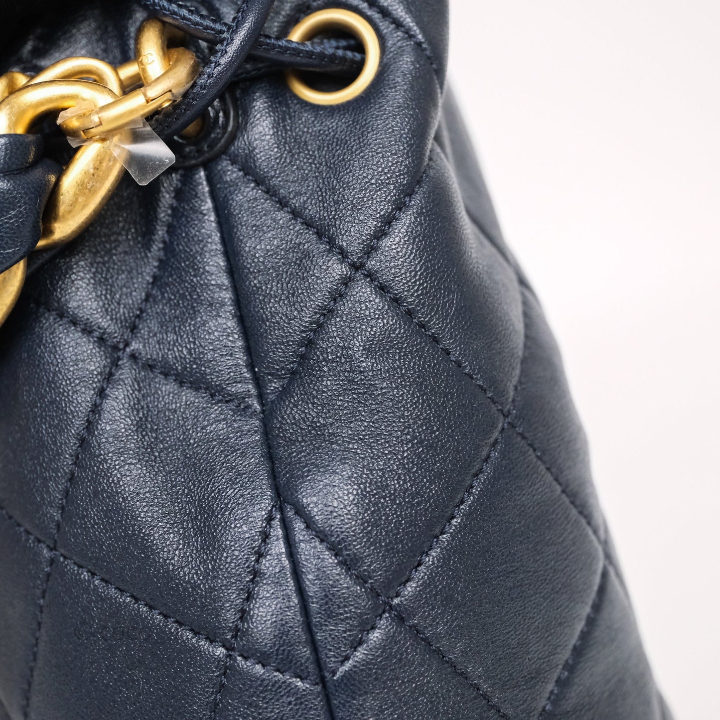 Chanel Small Entwined Chain Drawstring Bucket Bag Navy Lambskin Age Gold Hardware