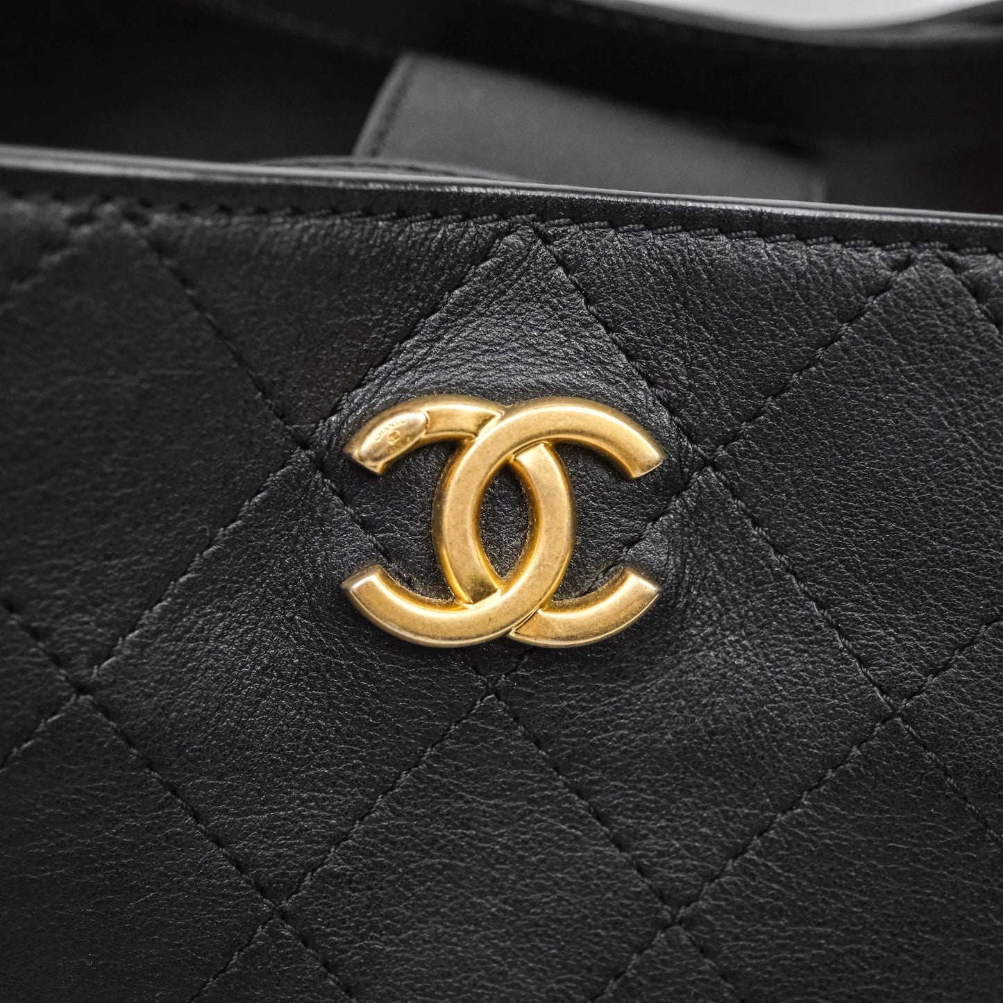 Chanel Quilted Drawstring Bucket Bag Black Calfskin Aged Gold Hardware
