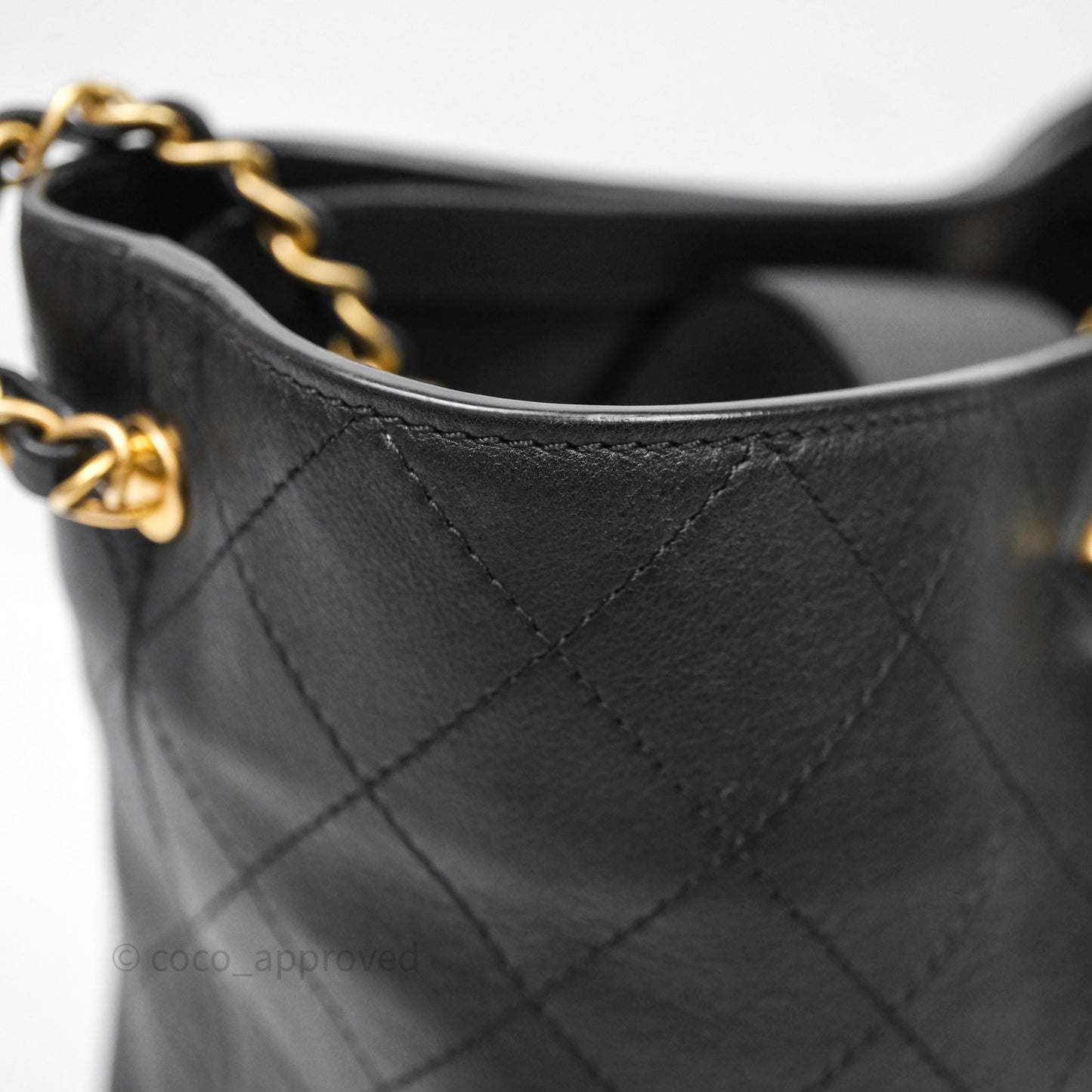 Chanel Quilted Drawstring Bucket Bag Black Calfskin Aged Gold Hardware