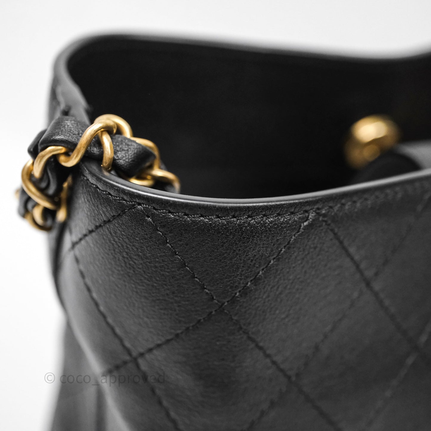 Chanel Quilted Drawstring Bucket Bag Black Calfskin Aged Gold Hardware